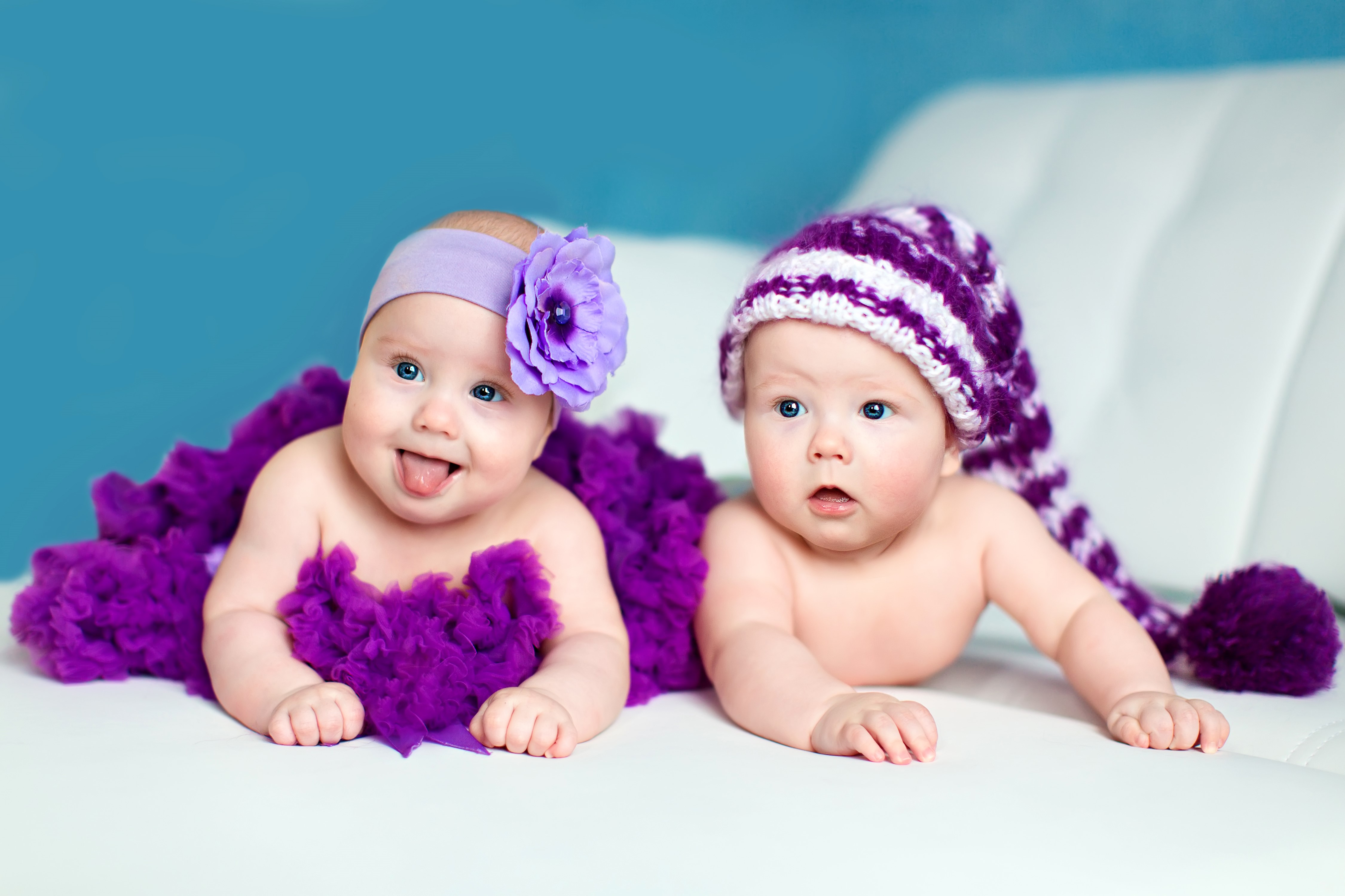 Two babies in purple outfits HD Wallpaper