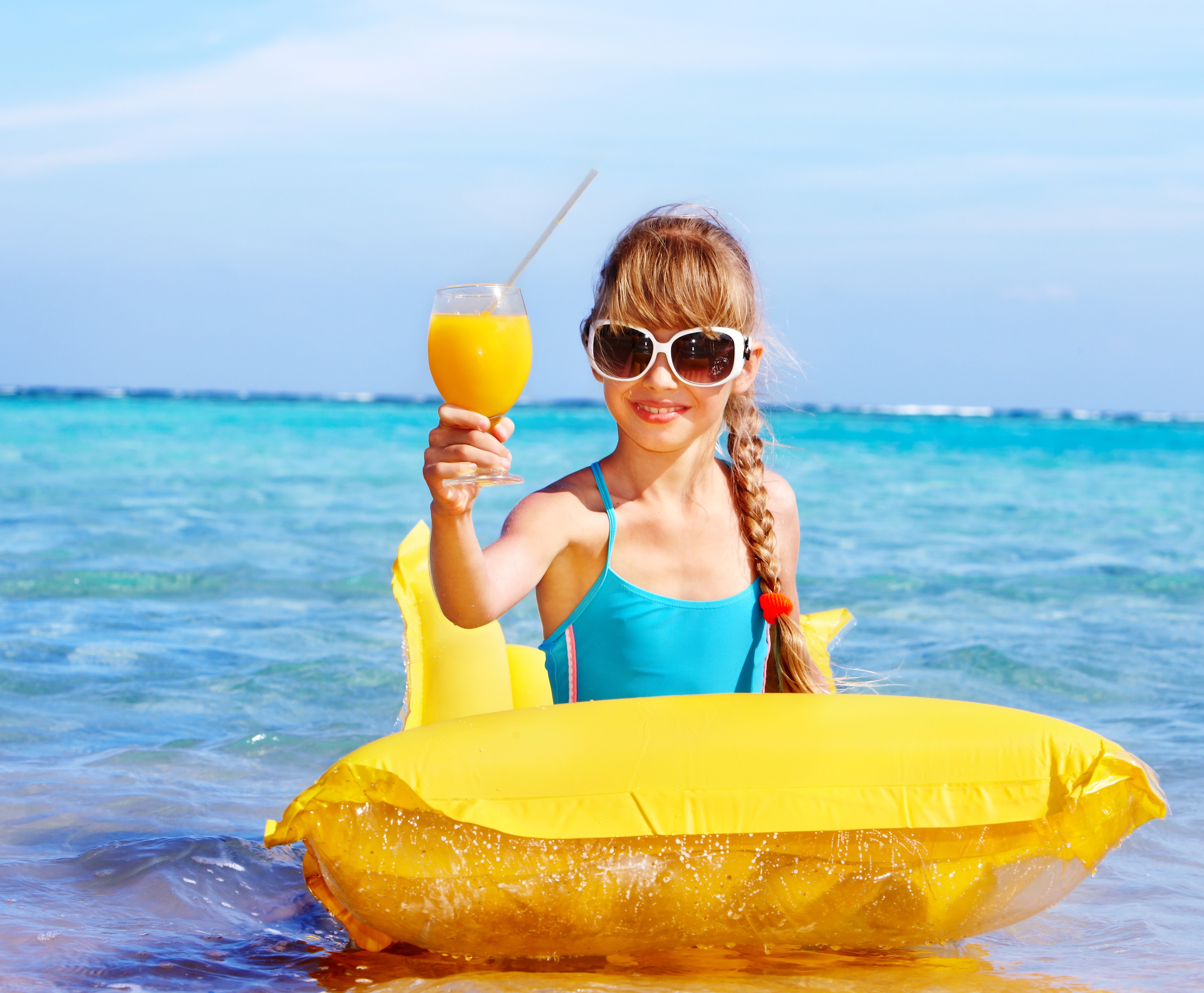 Girl with Juice on Yellow Float in Clear Sea HD Wallpaper