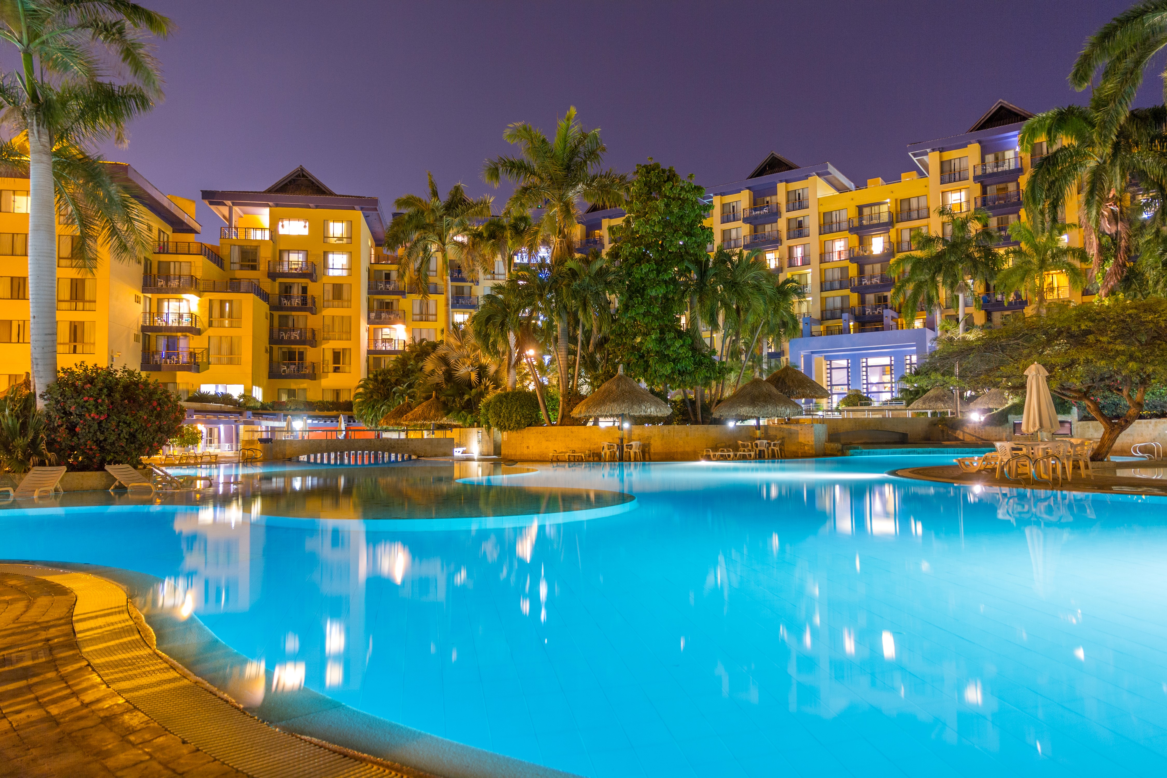 Resort with pool at night in Santa Marta, Colombia HD Wallpaper