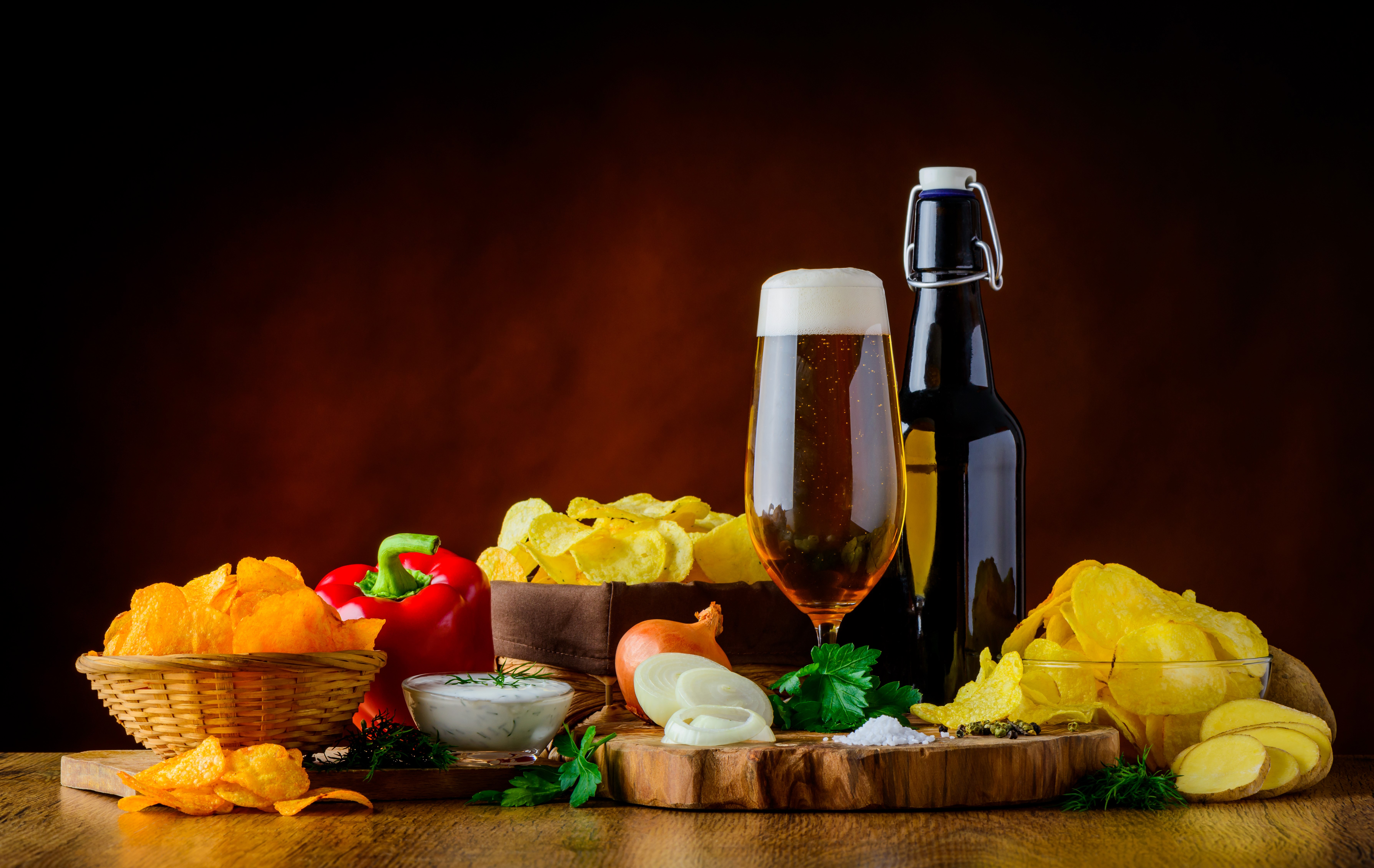Still-life of beer, bell pepper, onion, and chips HD Wallpaper
