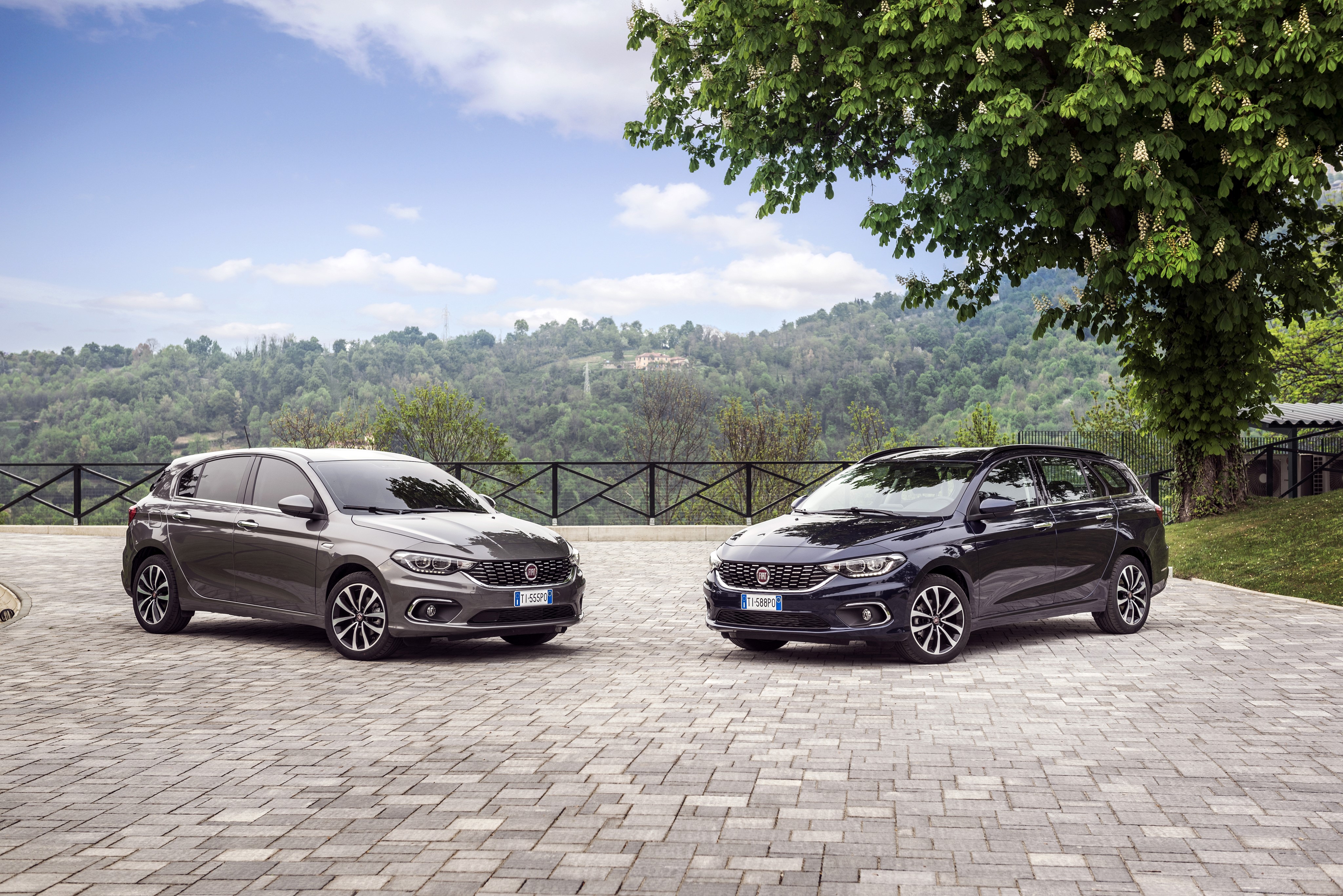 Two Fiat Tipo cars parked outdoors HD Wallpaper