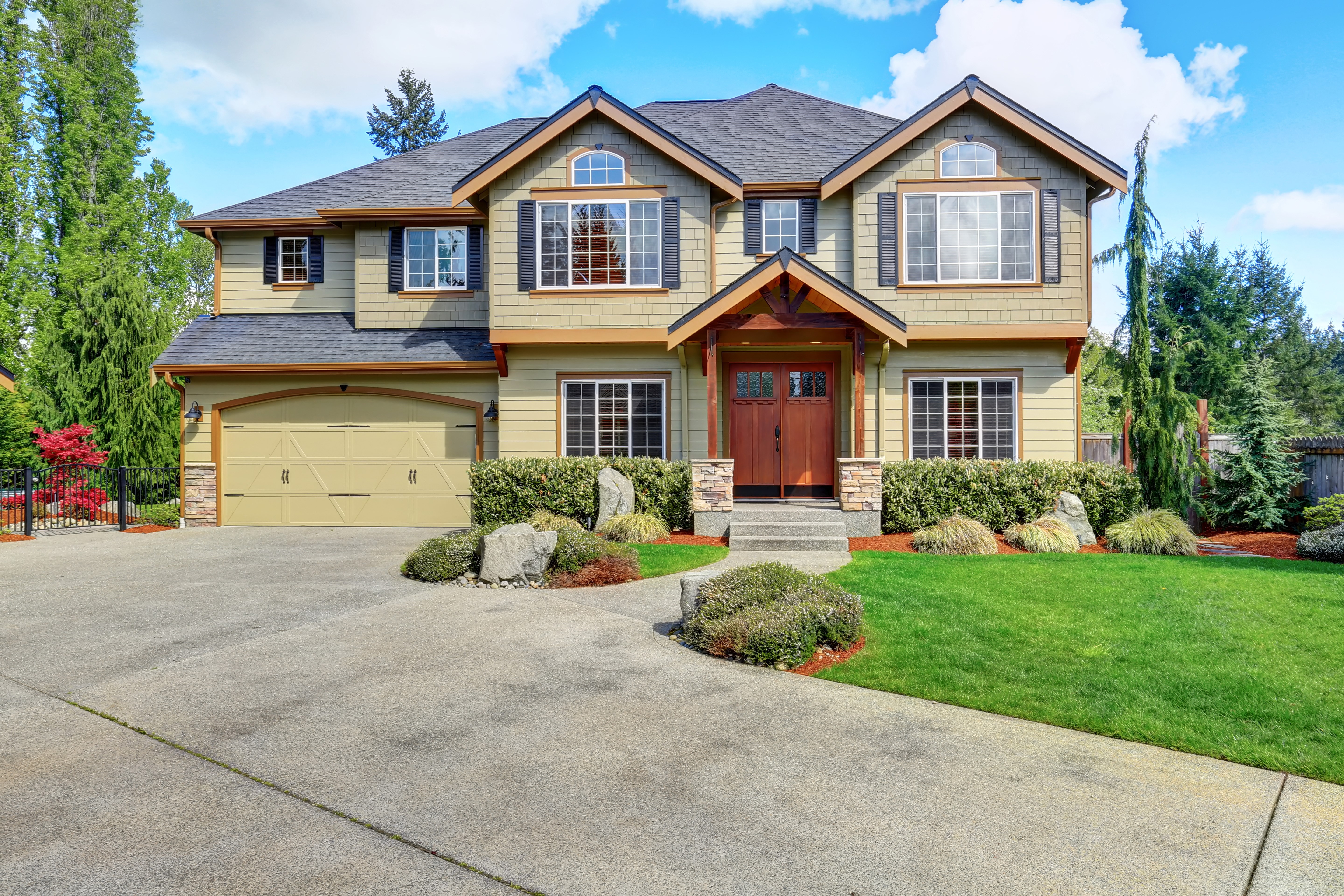 Luxury two-story house with garage and manicured lawn HD Wallpaper