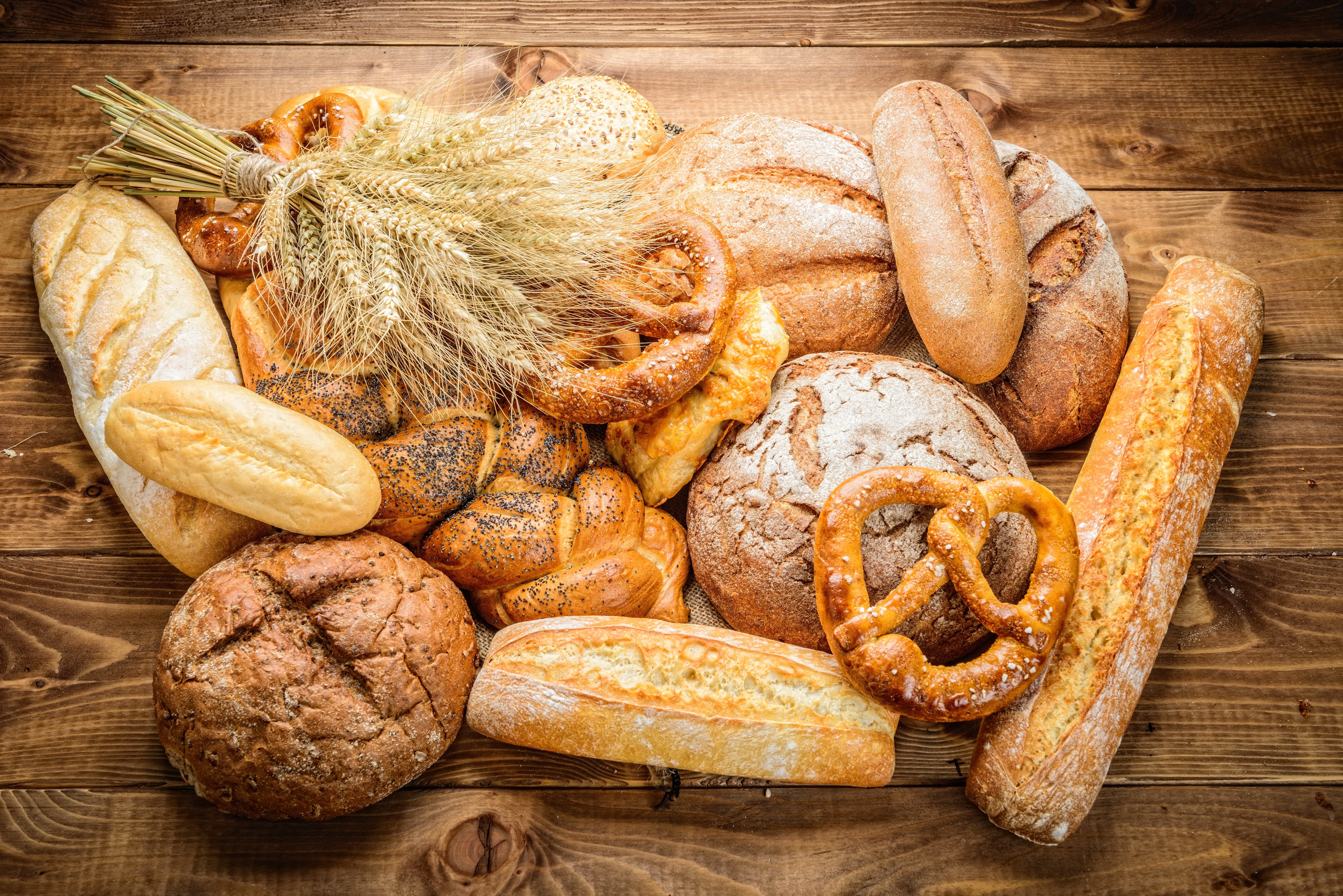 Assortment of Bread, Pastries, and Wheat Stalks HD Wallpaper