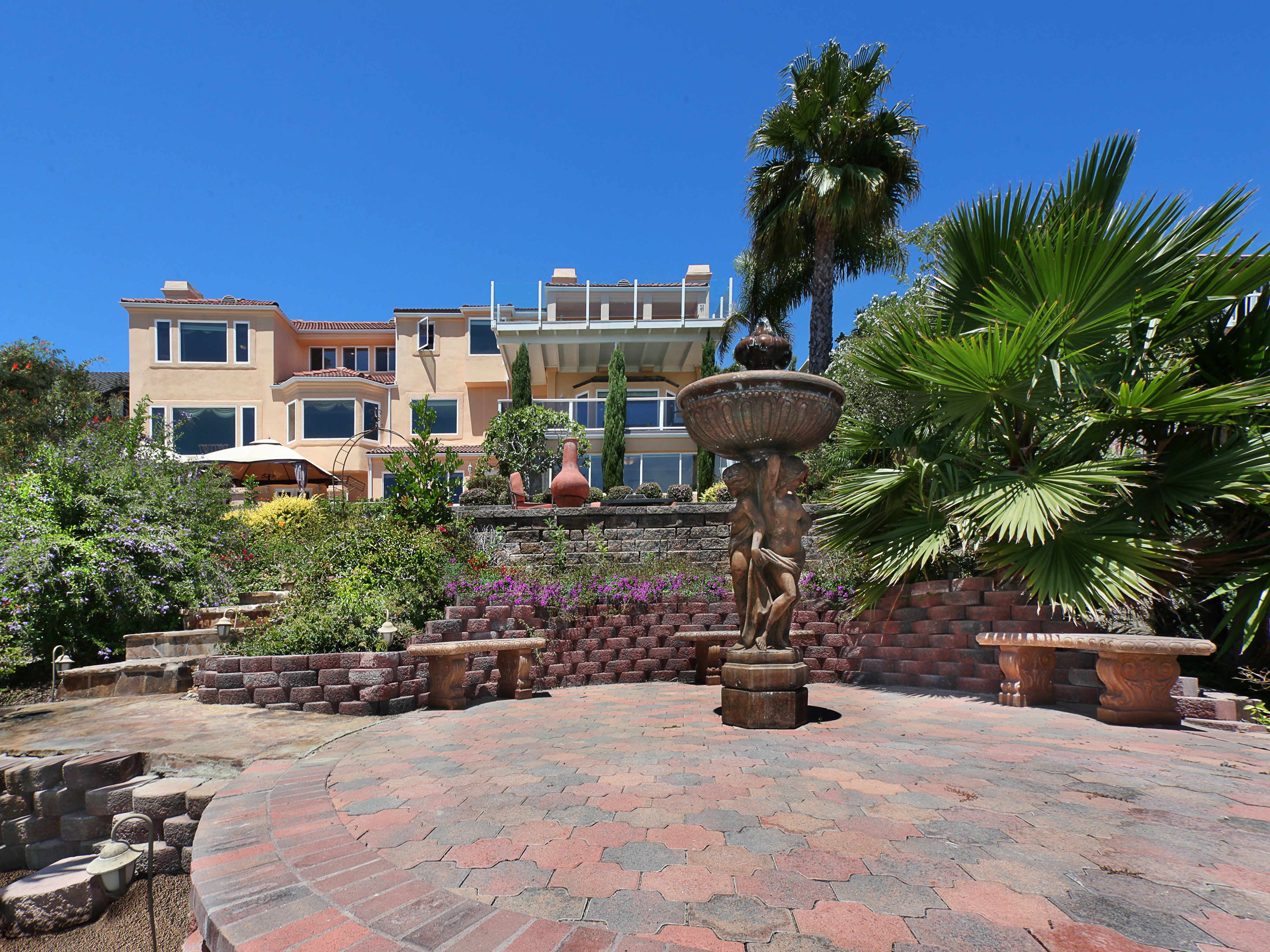 Luxury Mansion with Fountain and Landscaped Garden HD Wallpaper
