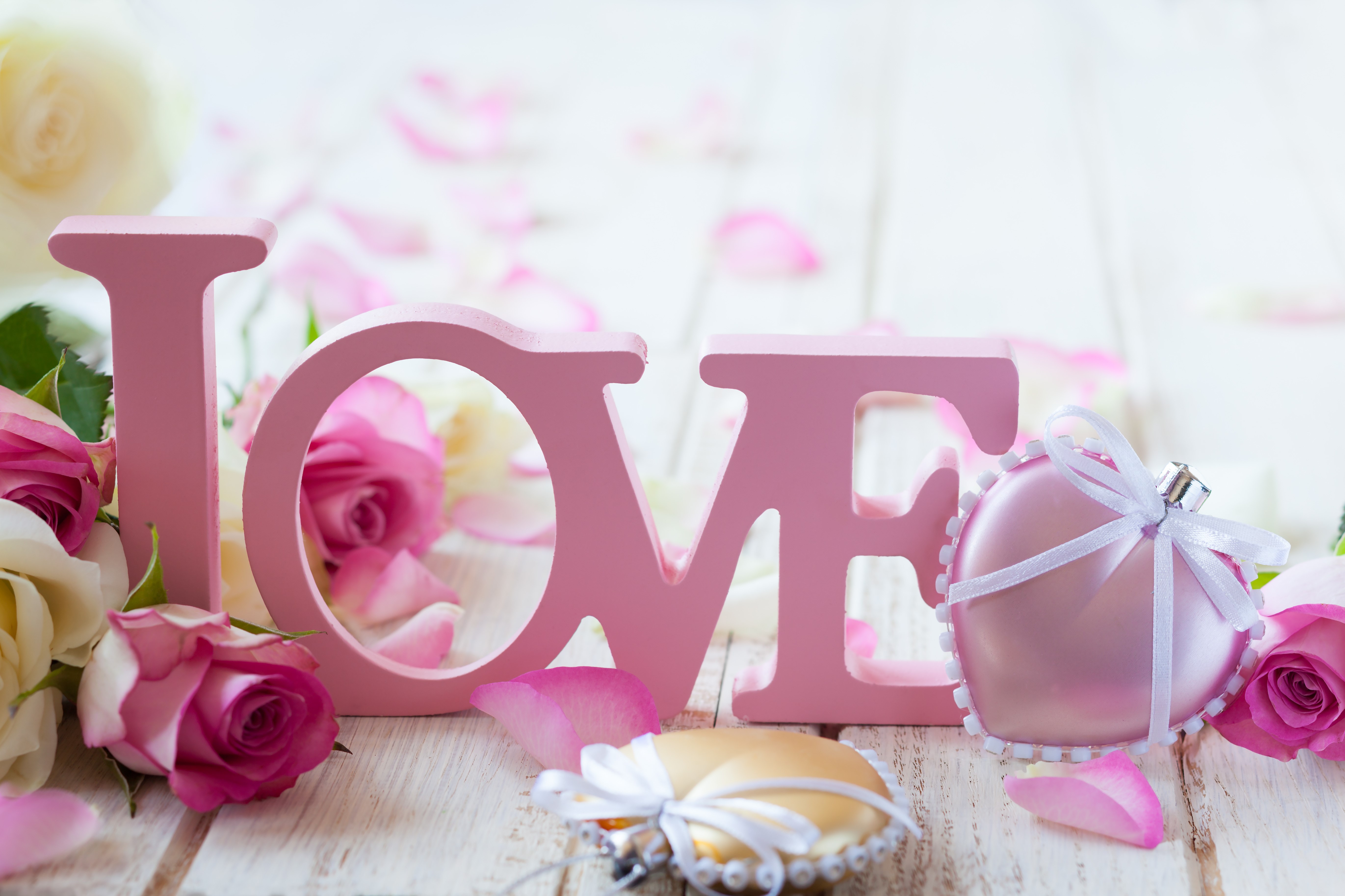 Pink wooden letters spelling LOVE with roses and heart ornaments HD Wallpaper