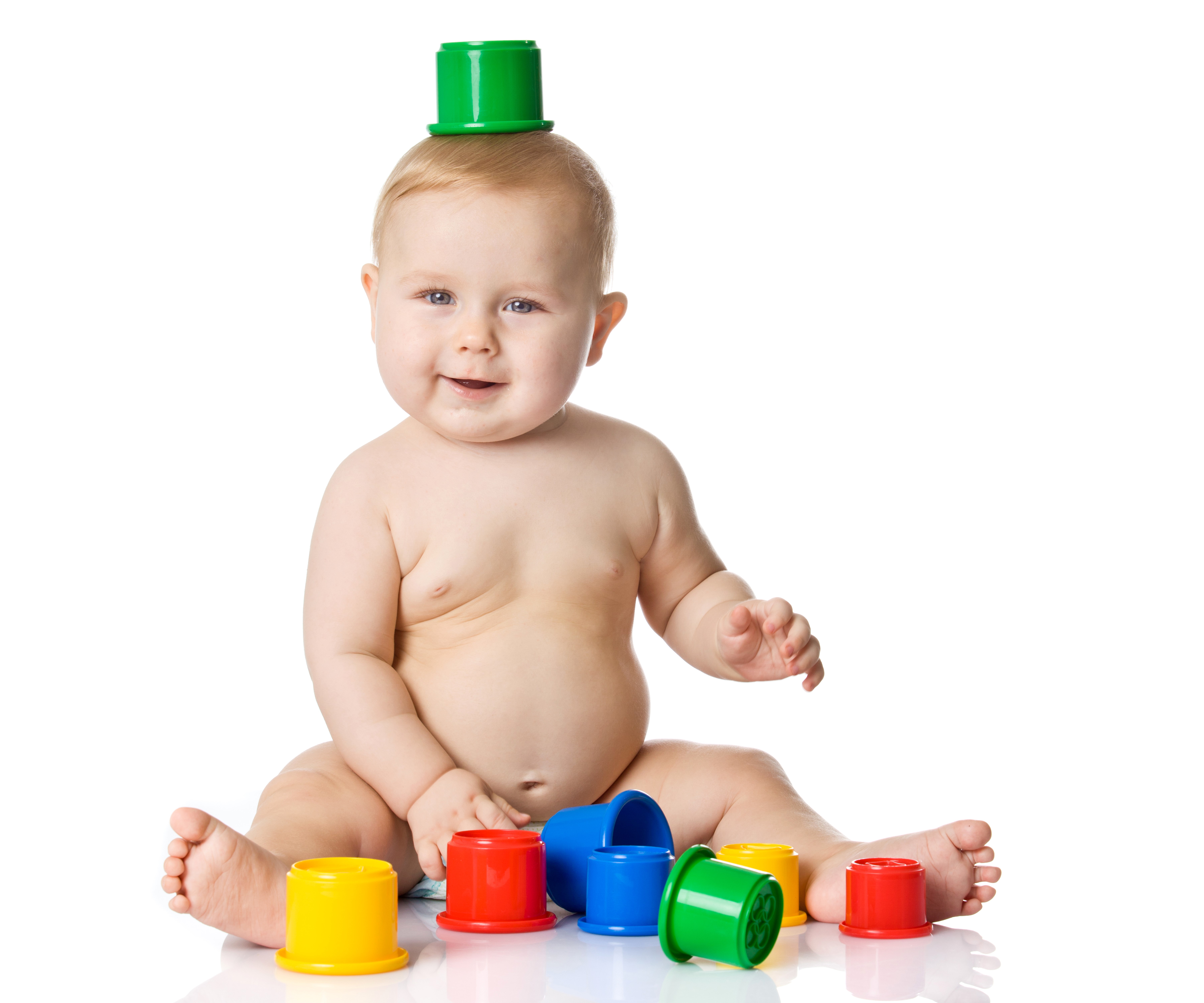 Baby with stacking cups on white background HD Wallpaper