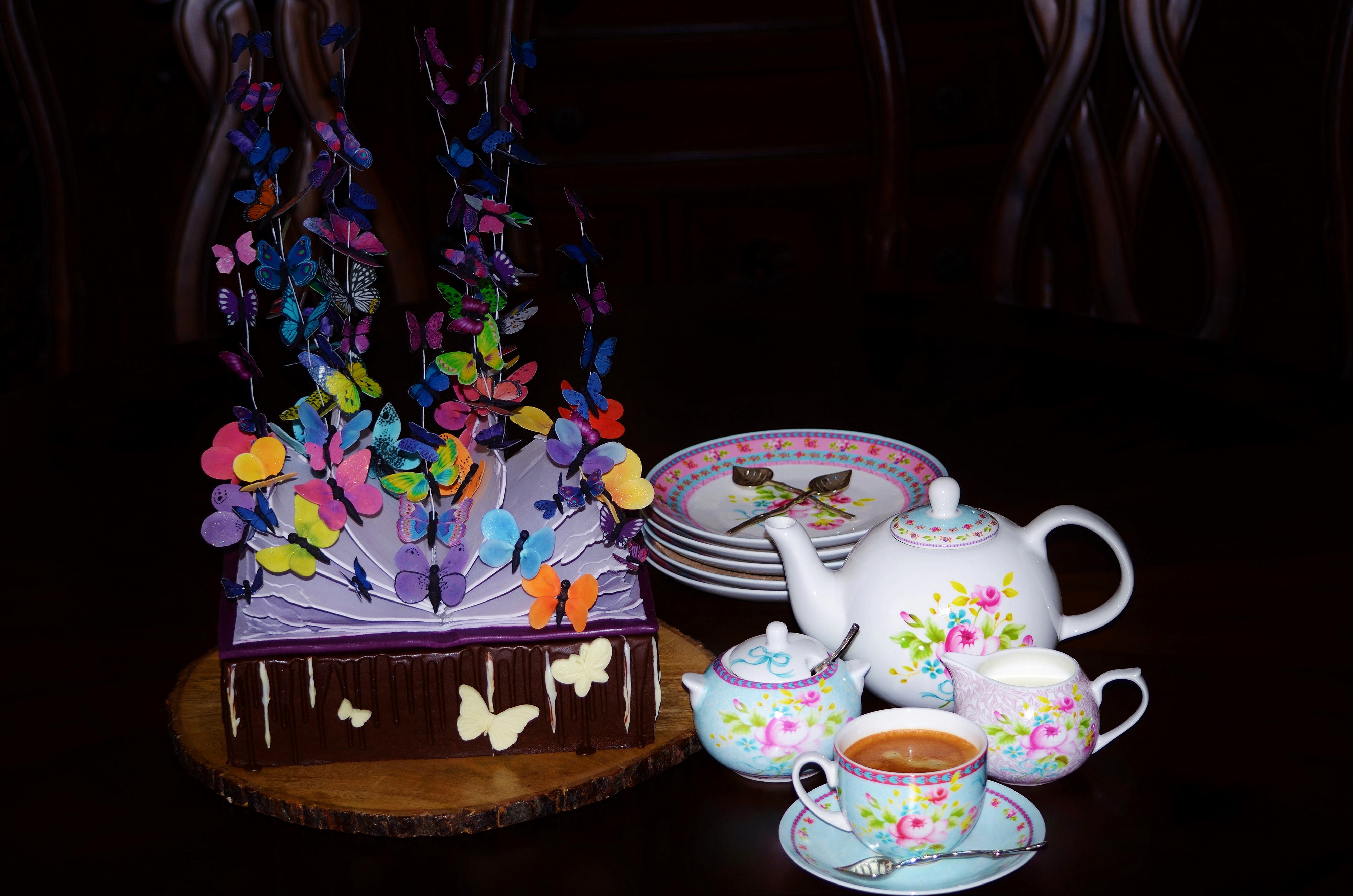 Still-life of a cake with butterflies and tea set HD Wallpaper