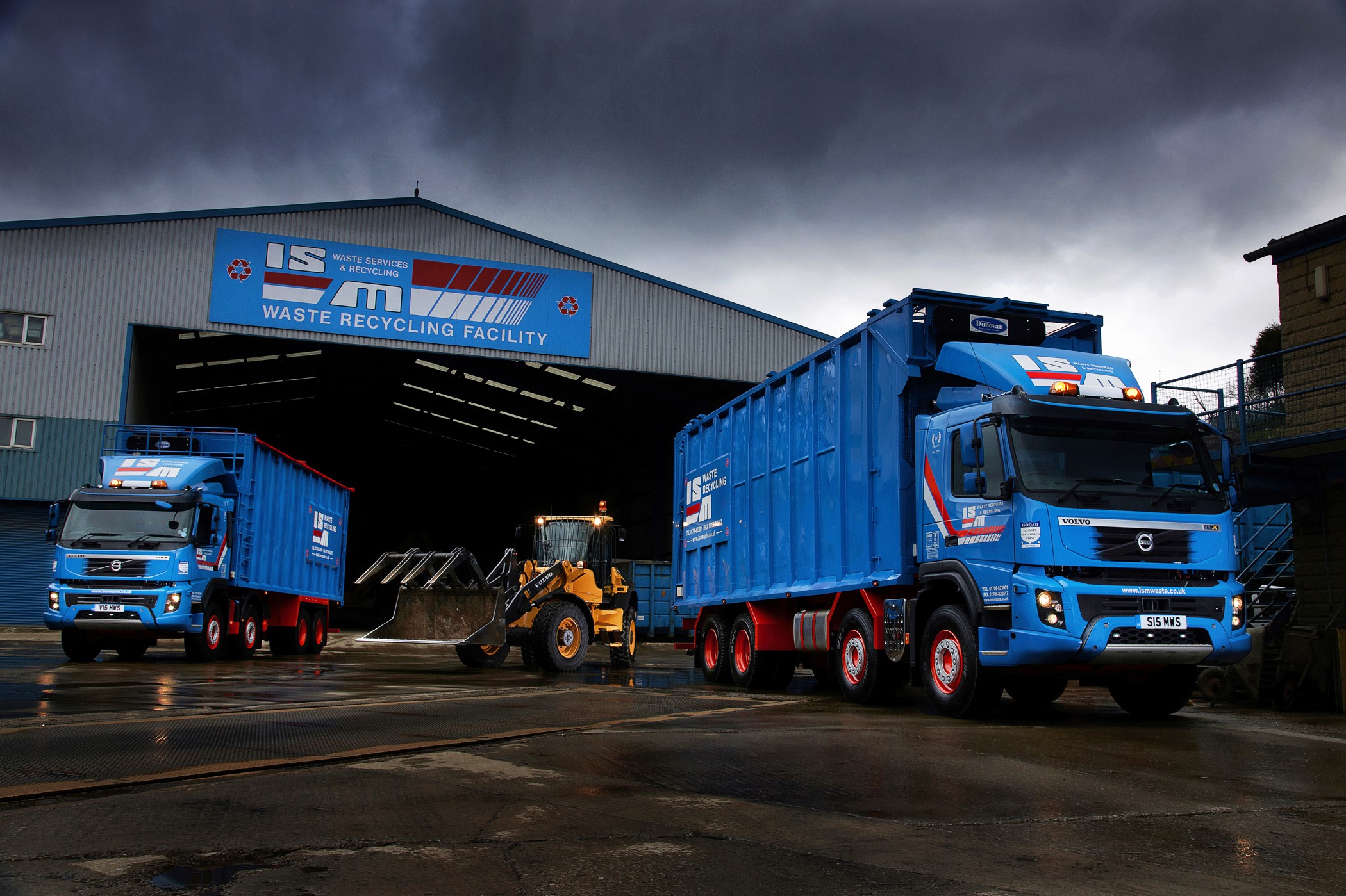 IS Waste Recycling Facility with Volvo Trucks and Loader HD Wallpaper