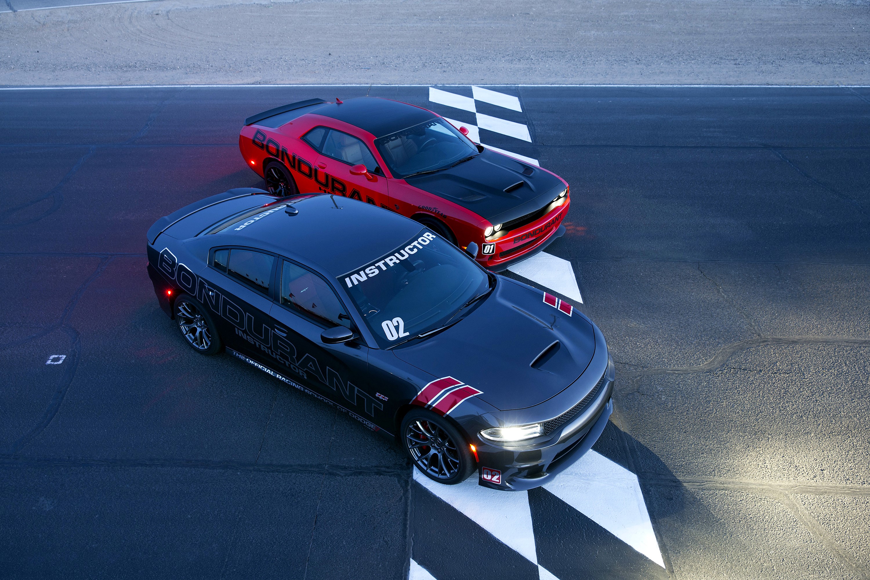 Two Dodge cars on a race track HD Wallpaper