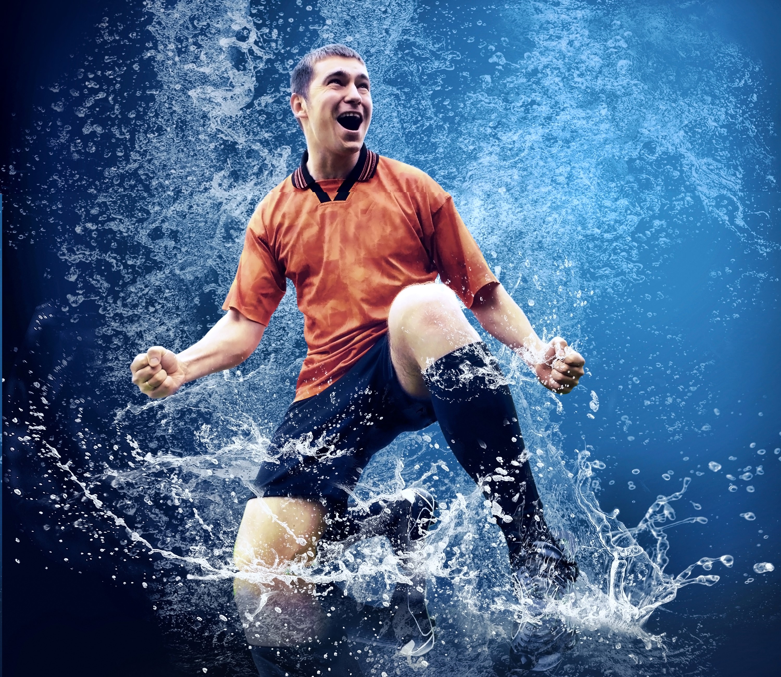 Soccer player celebrating in water splash HD Wallpaper