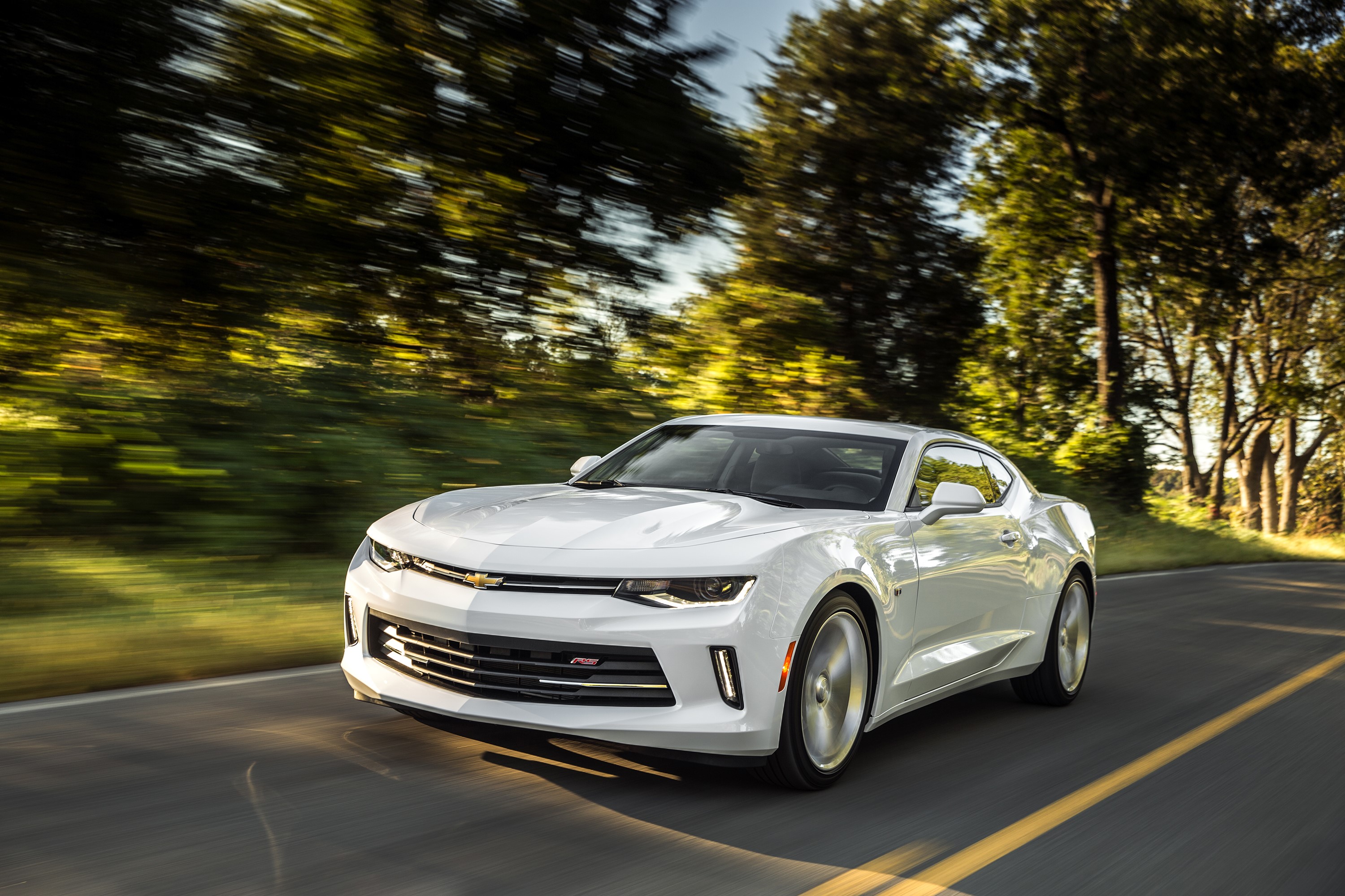 White Chevrolet Camaro RS driving on a road HD Wallpaper