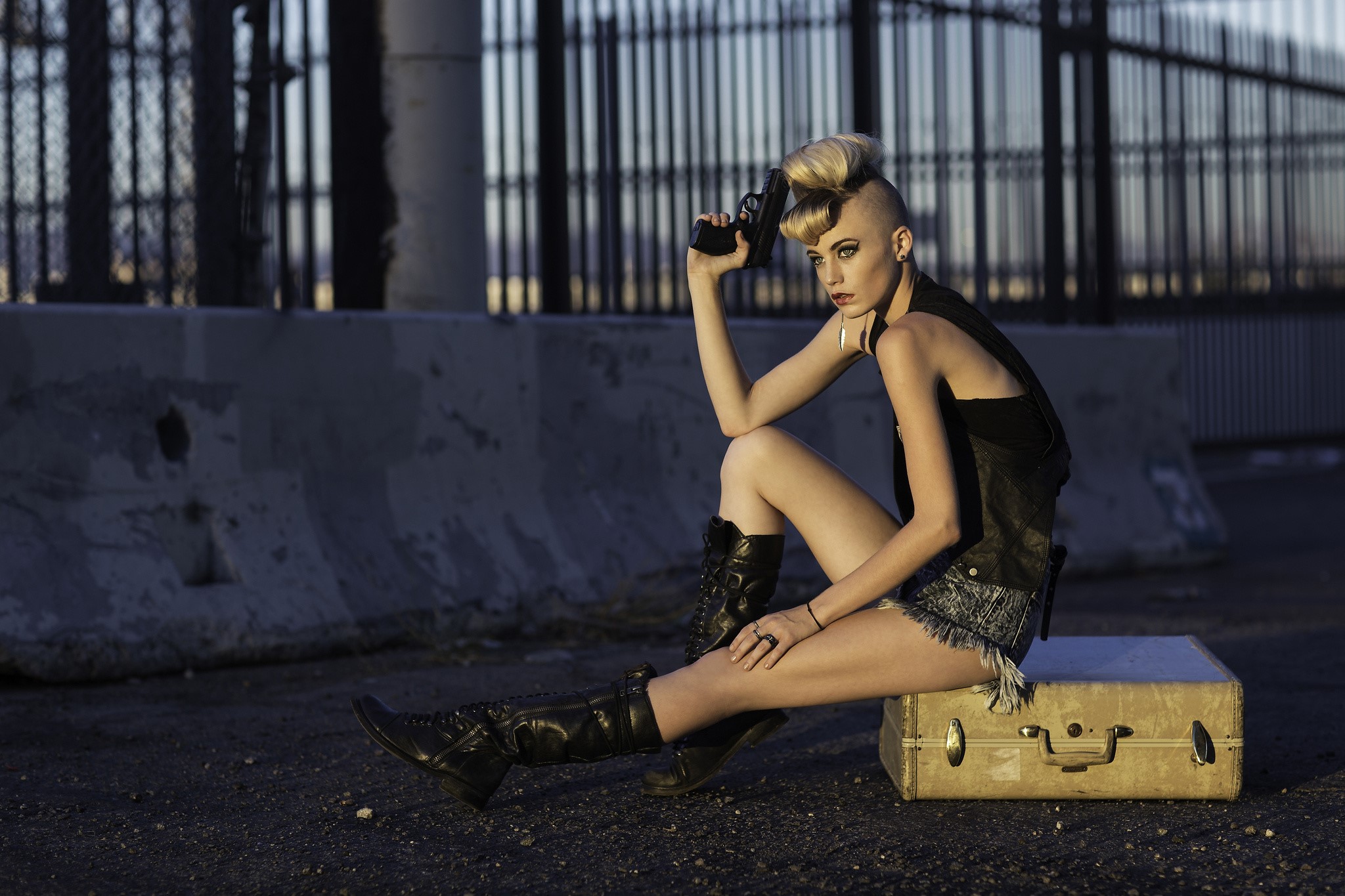 Margo Hammand with a pistol and suitcase HD Wallpaper
