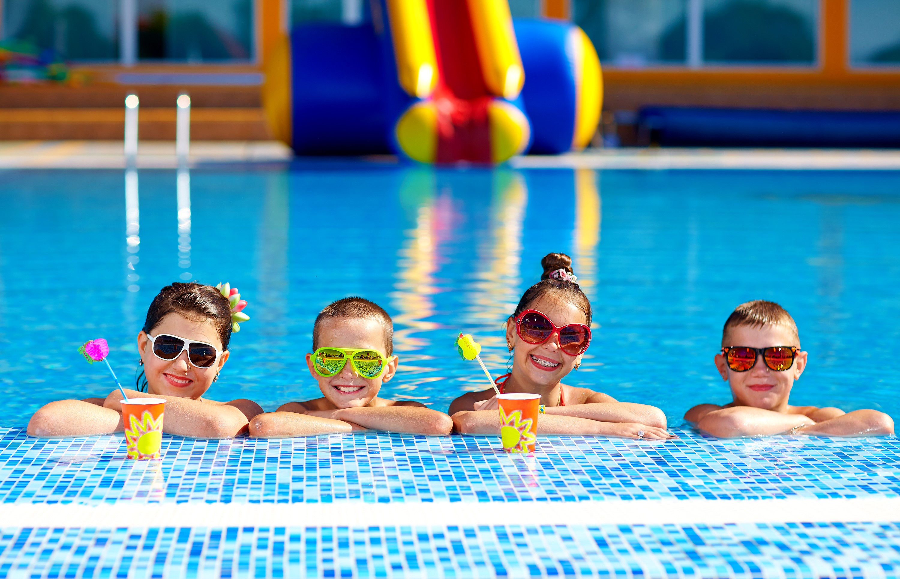 Children in sunglasses by the pool with drinks HD Wallpaper