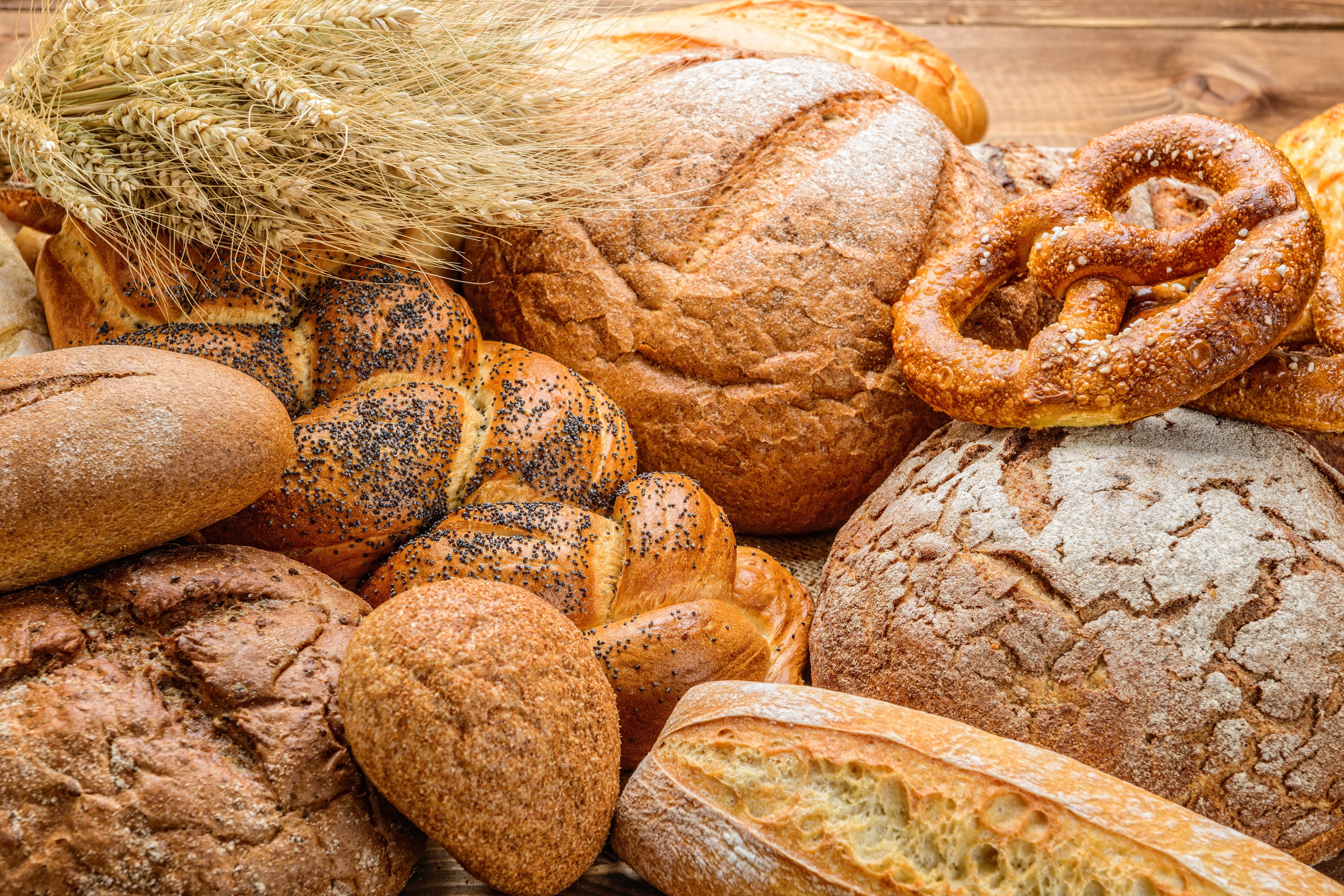 Assortment of Bread and Wheat Stalks HD Wallpaper