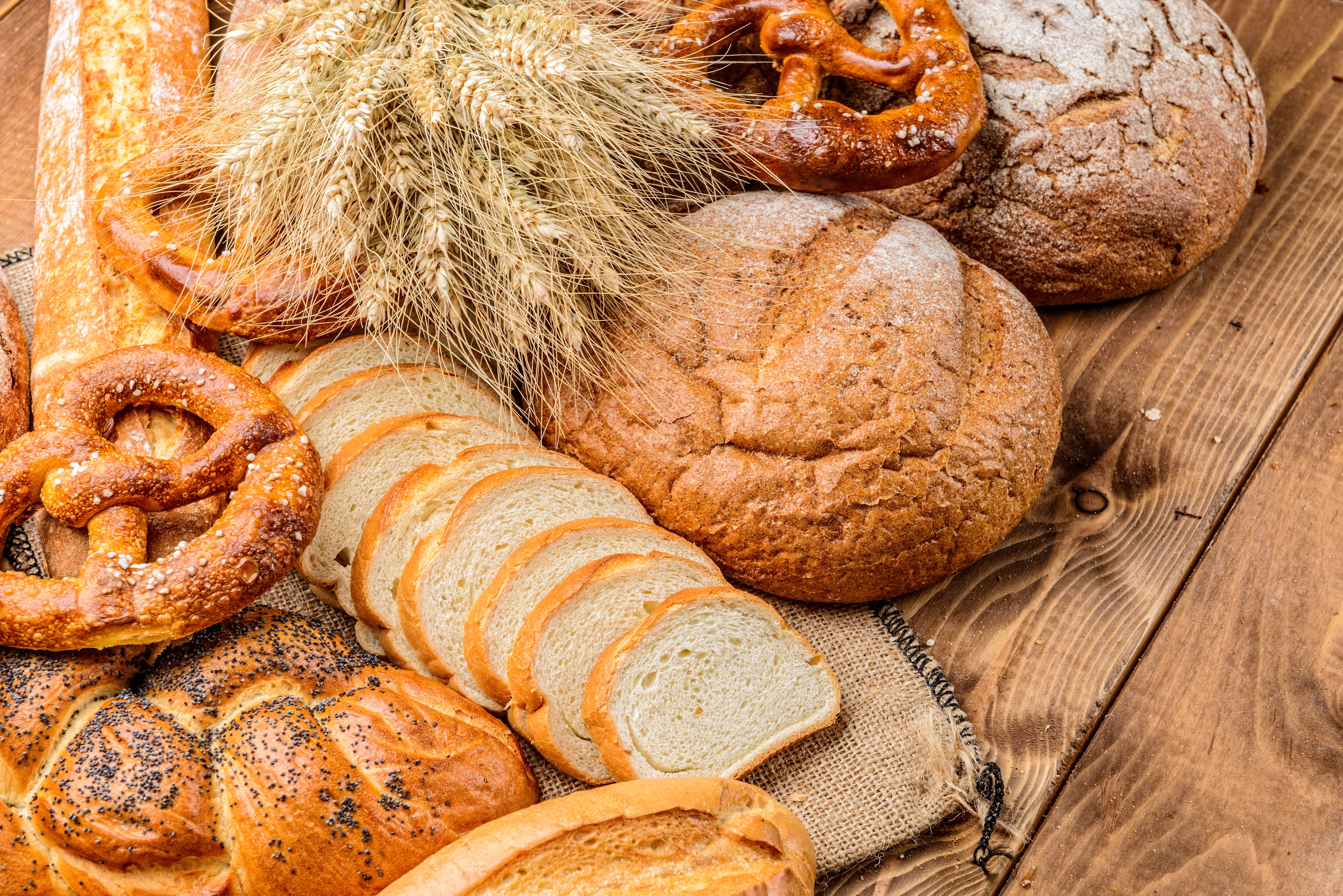 Assortment of Bread and Wheat Stalks HD Wallpaper