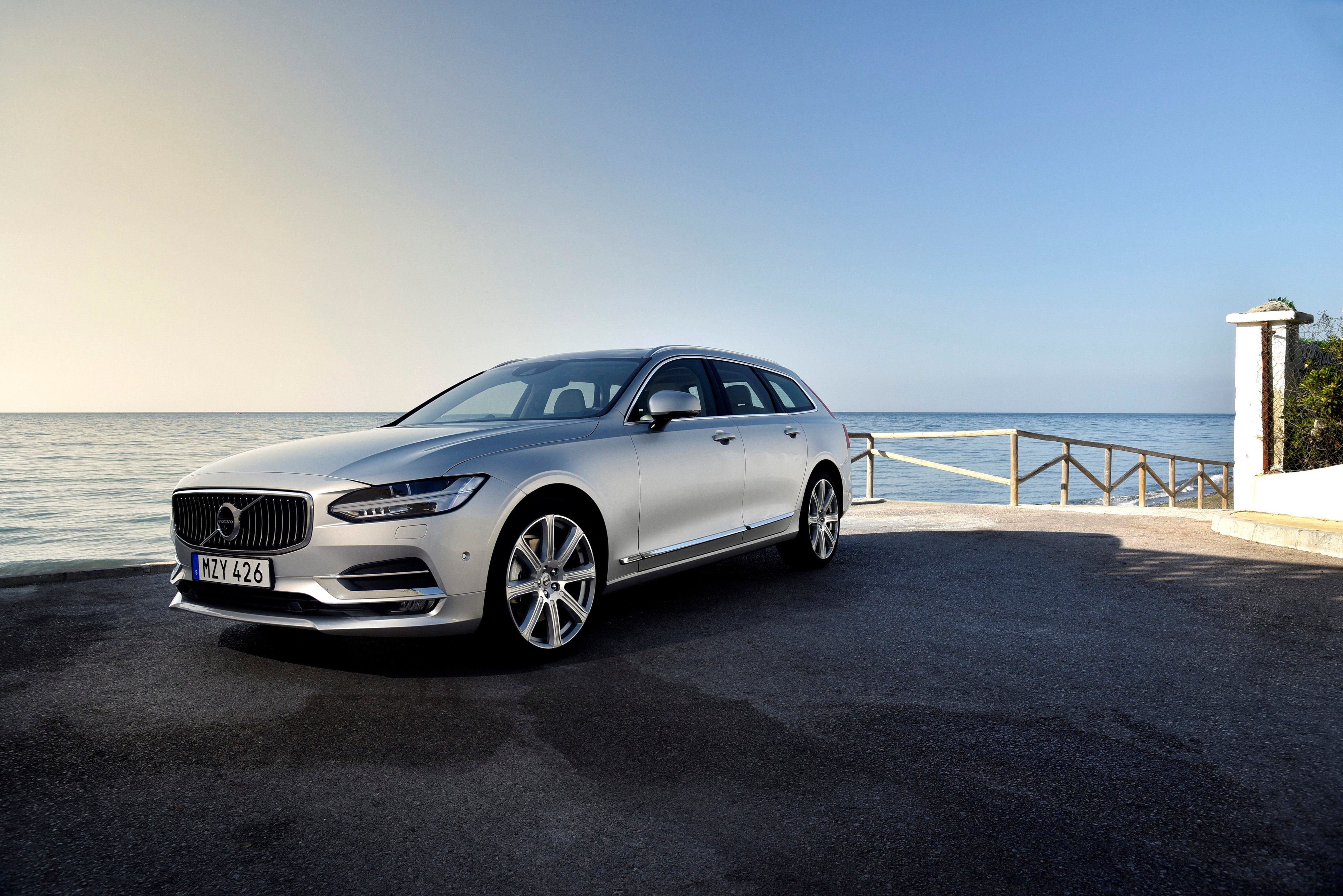 Silver Volvo V90 parked by the sea HD Wallpaper