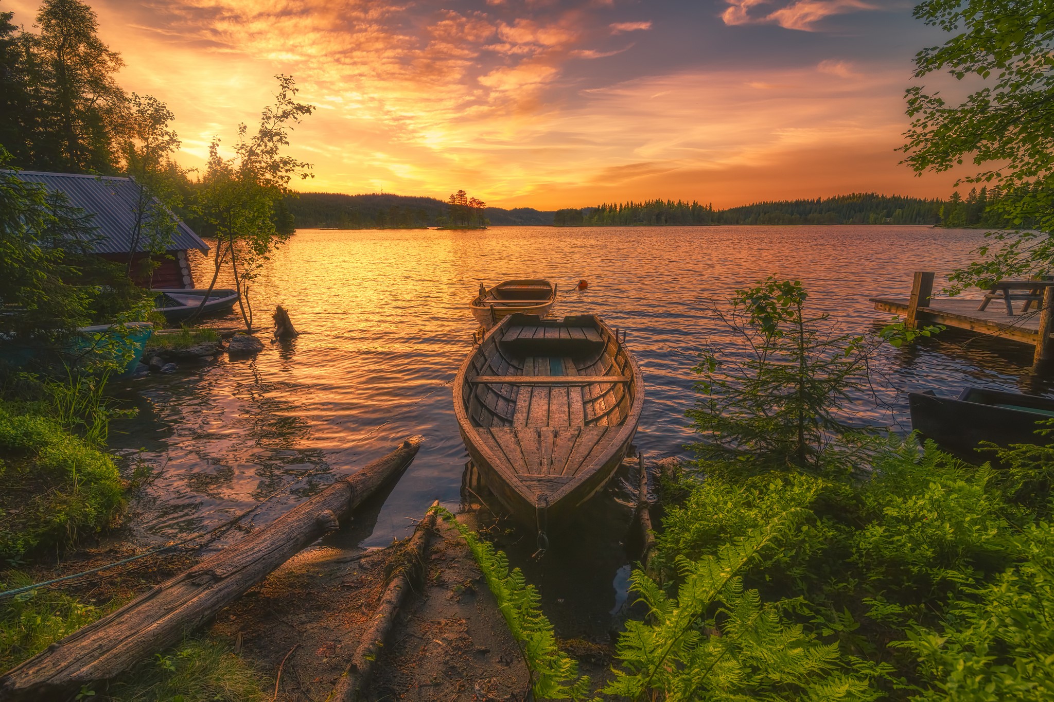 Boats on a lake at sunset HD Wallpaper