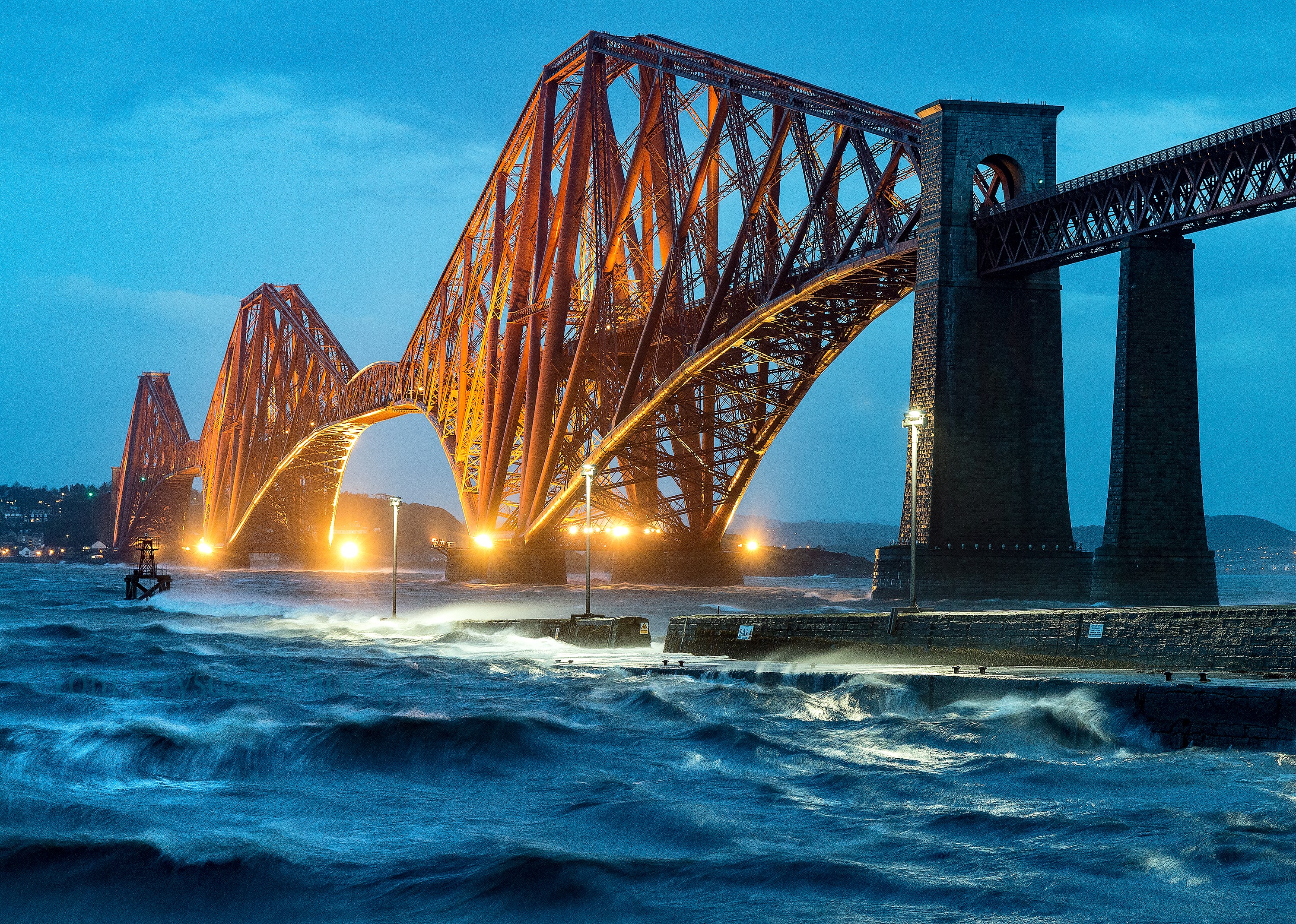 Forth Bridge at night with stormy waves HD Wallpaper