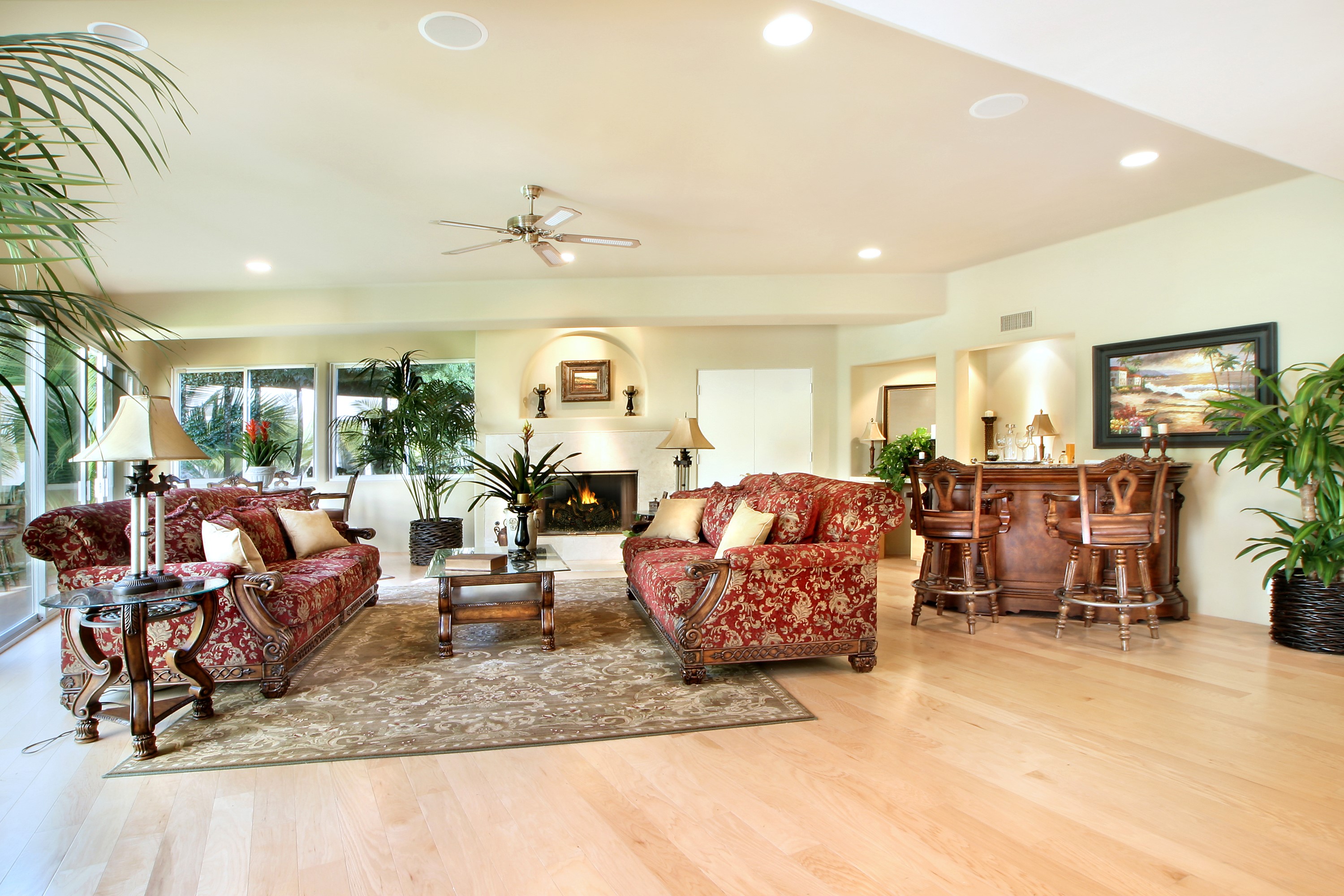 Living room with fireplace, bar, and sofas HD Wallpaper