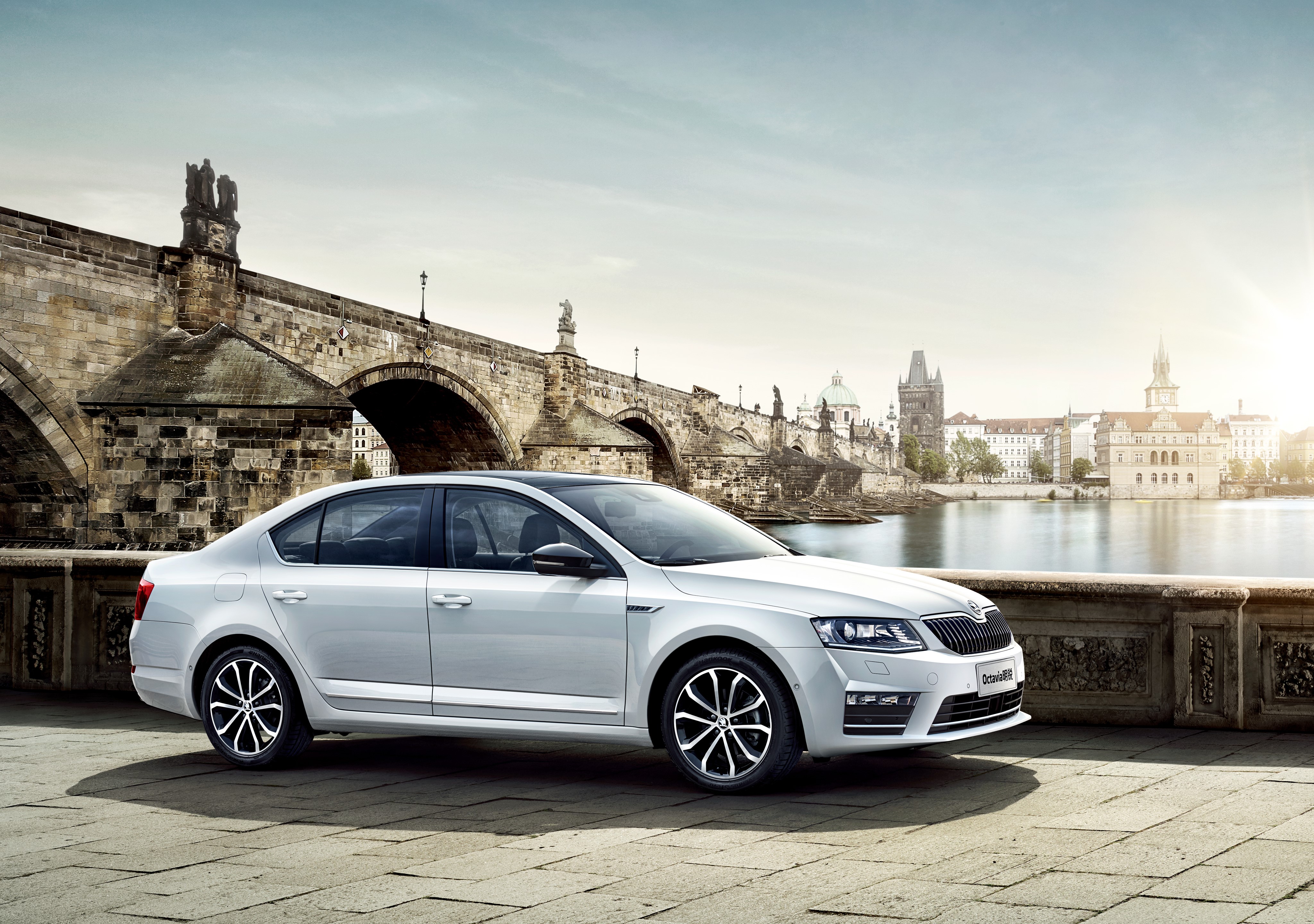 White Skoda Octavia Sedan by Charles Bridge, Prague HD Wallpaper