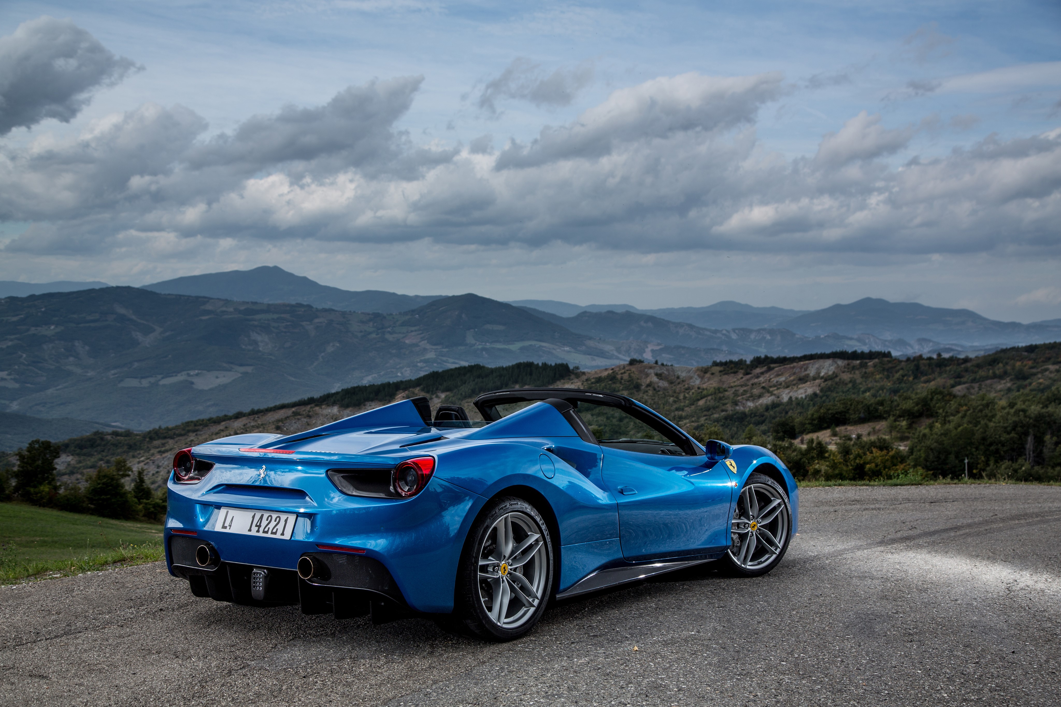 Blue Ferrari 488 Spider convertible in mountains HD Wallpaper