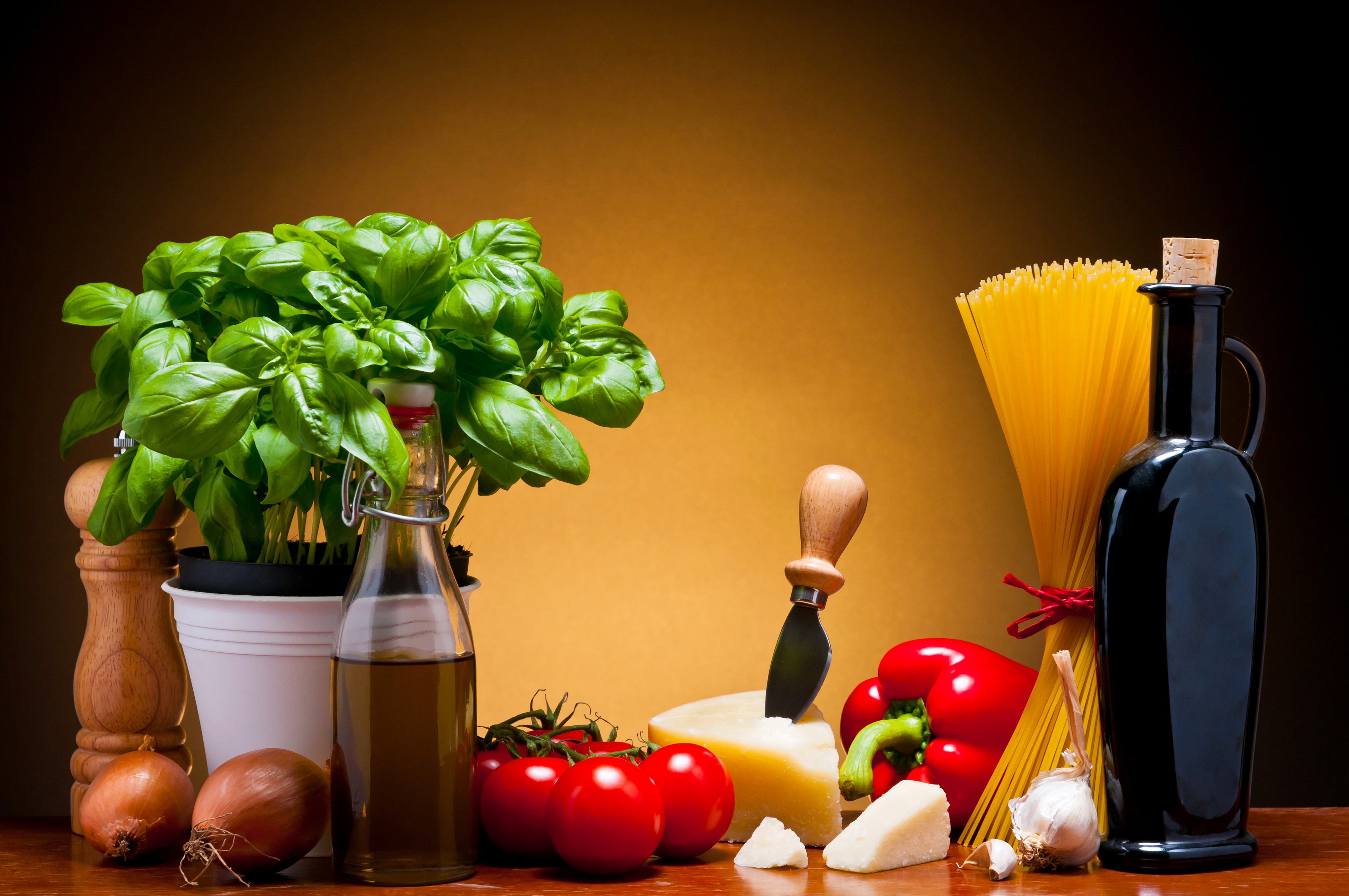 Still-life of Italian ingredients with pasta and olive oil HD Wallpaper
