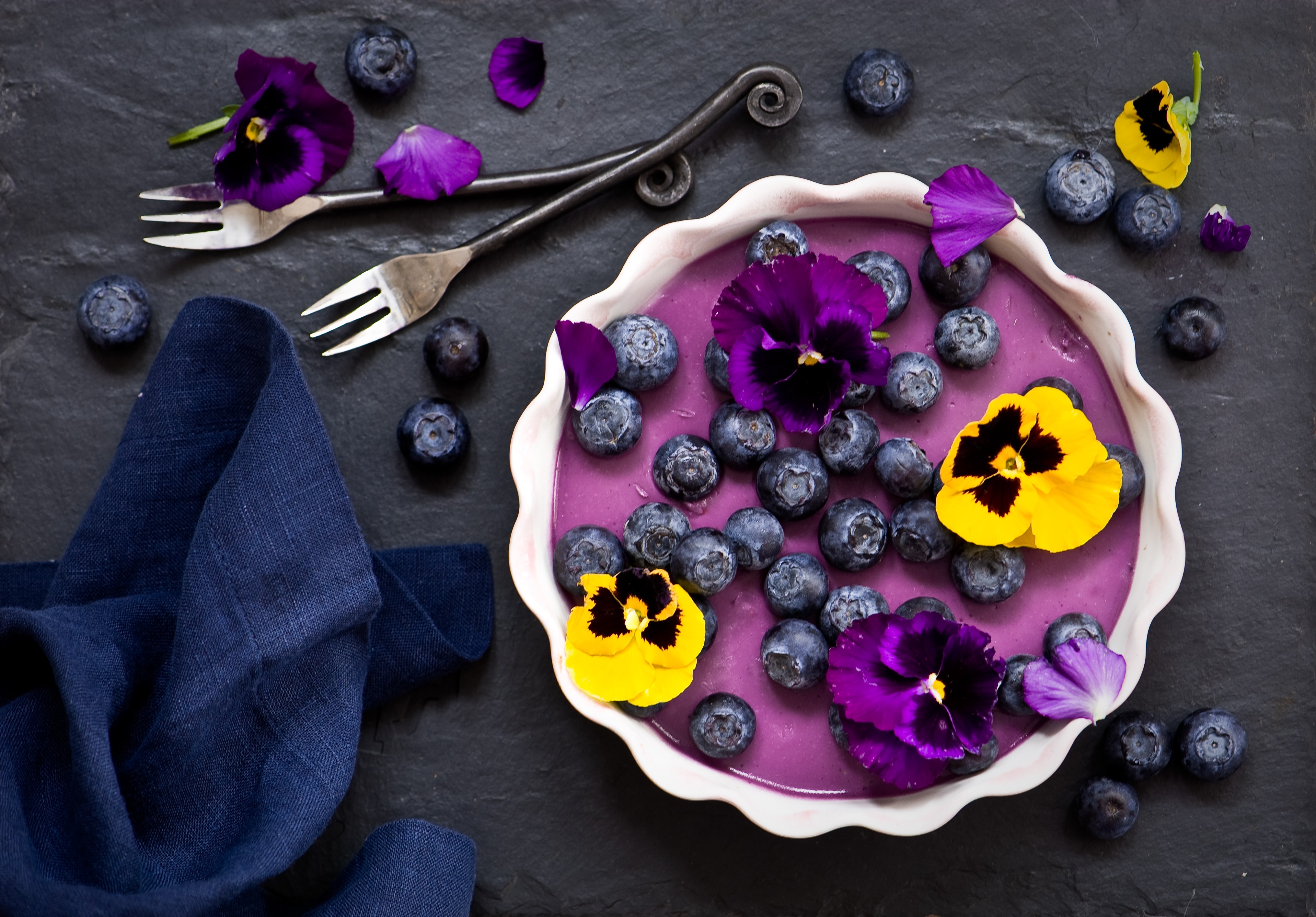 Blueberry dessert with pansies and forks HD Wallpaper