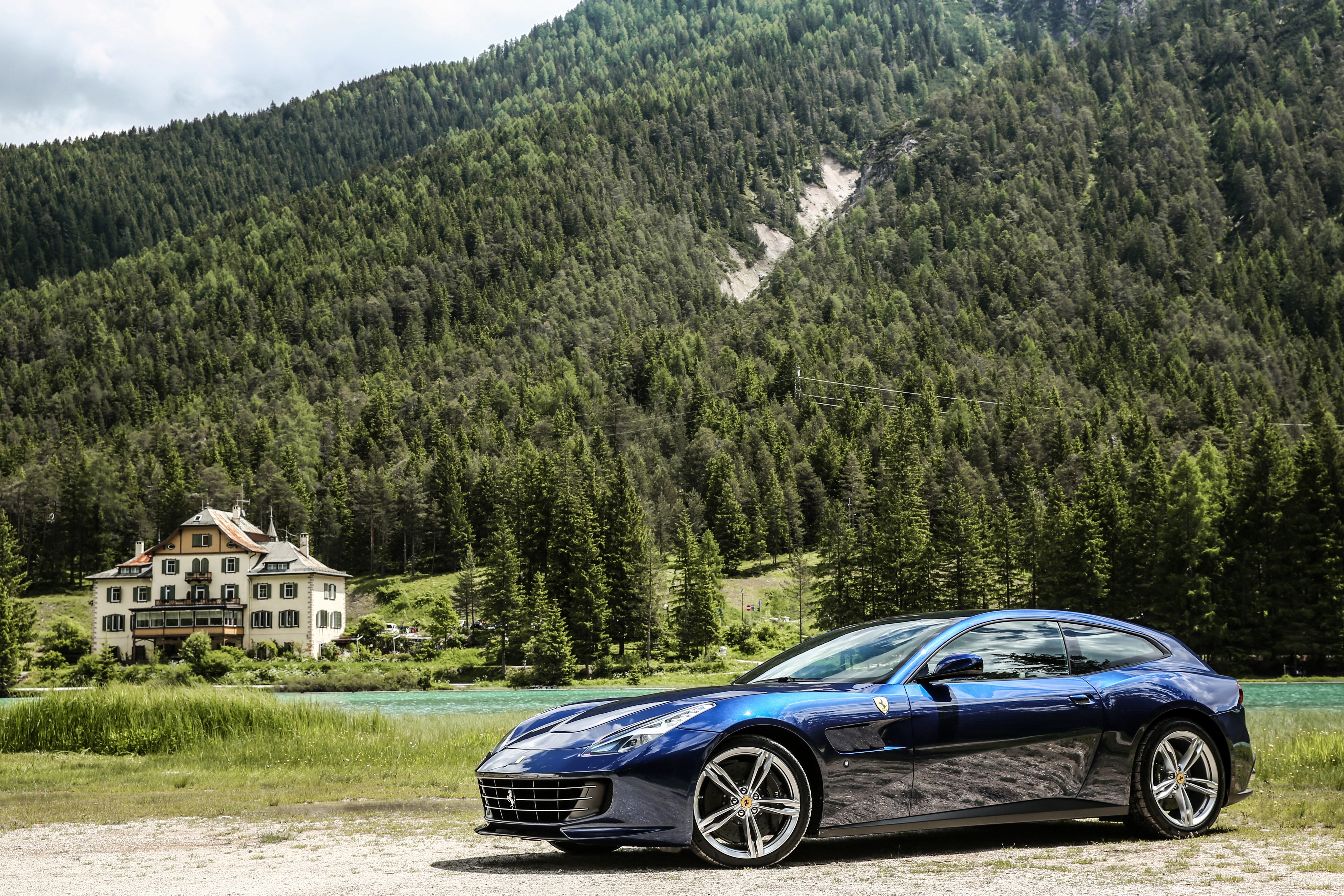 Blue Ferrari GTC4 Lusso in a Mountainous Forest HD Wallpaper