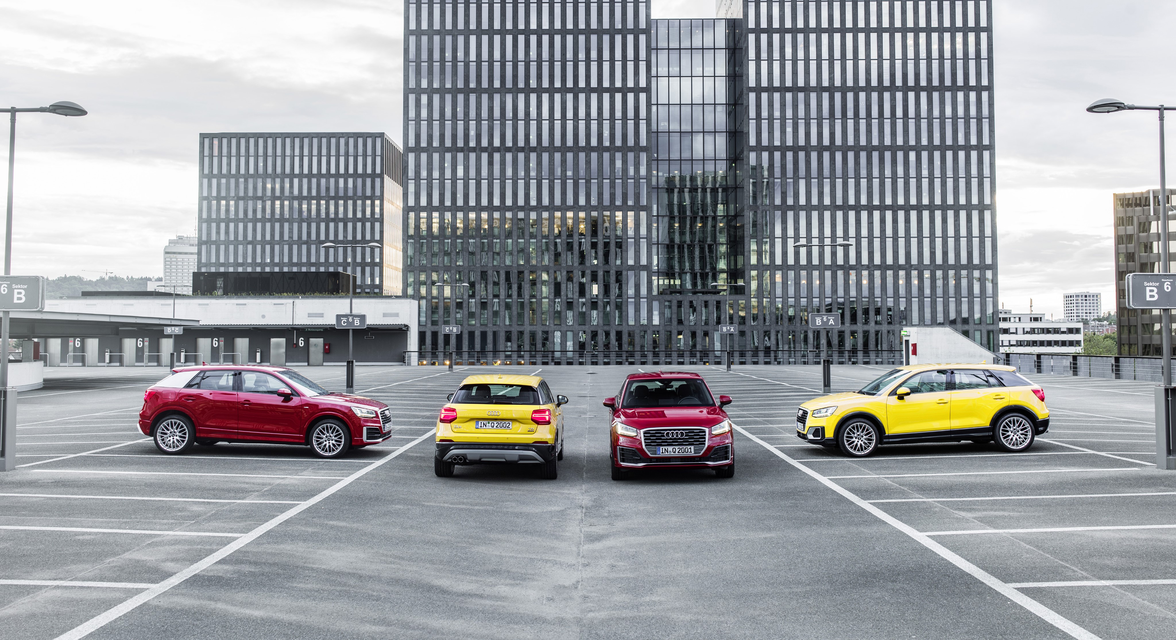 Audi Q2 cars in a parking lot HD Wallpaper