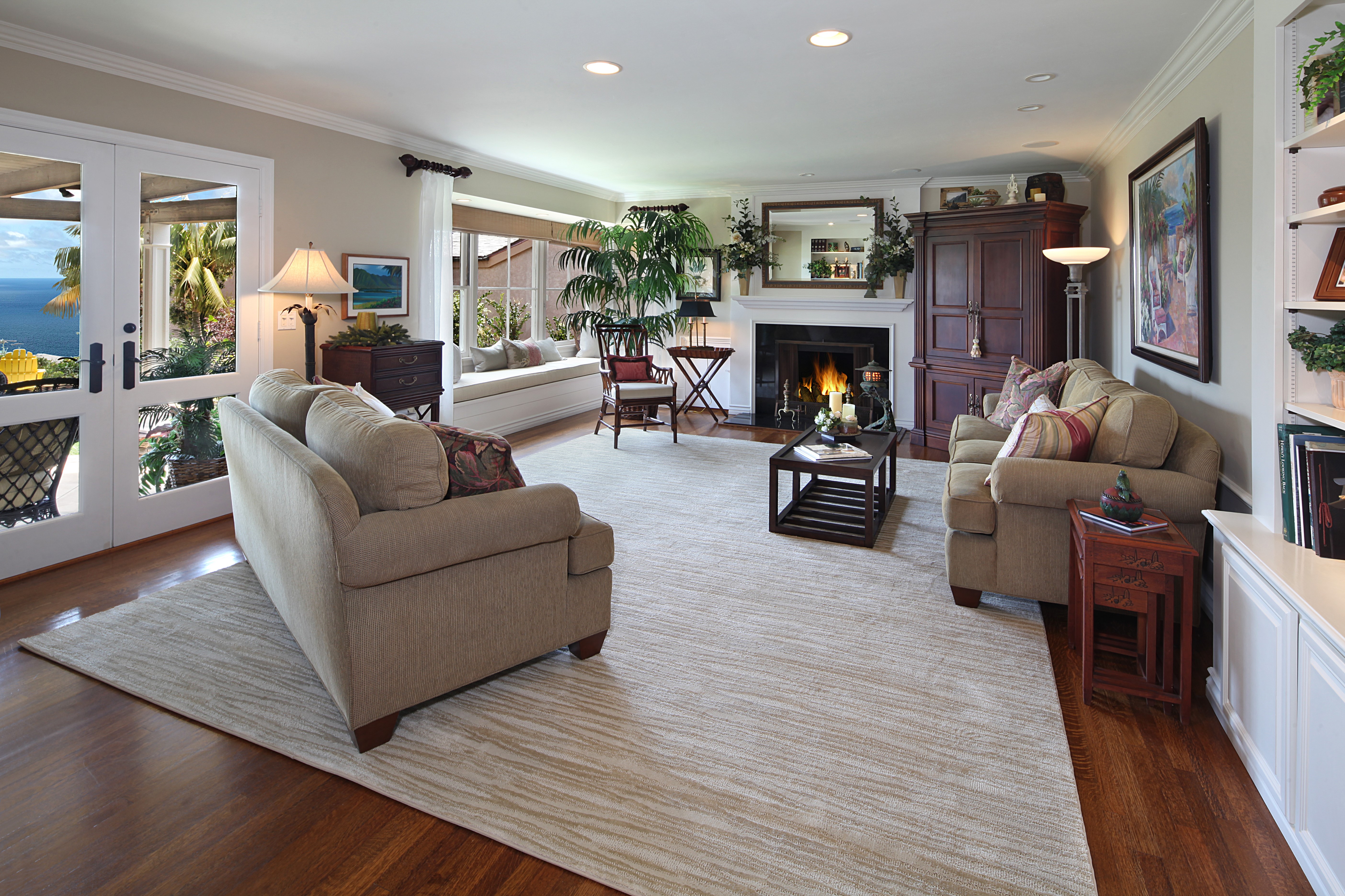 Living room with fireplace and ocean view HD Wallpaper