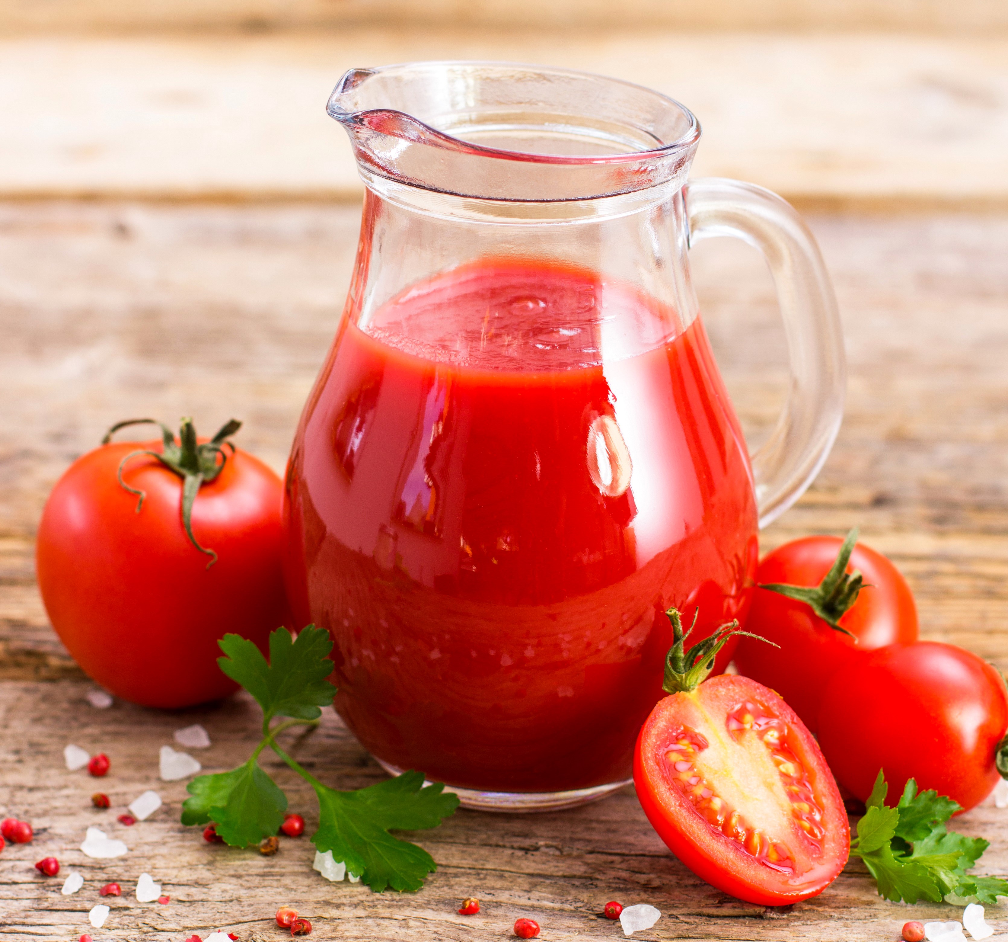 Tomato juice in a jug with tomatoes and parsley HD Wallpaper
