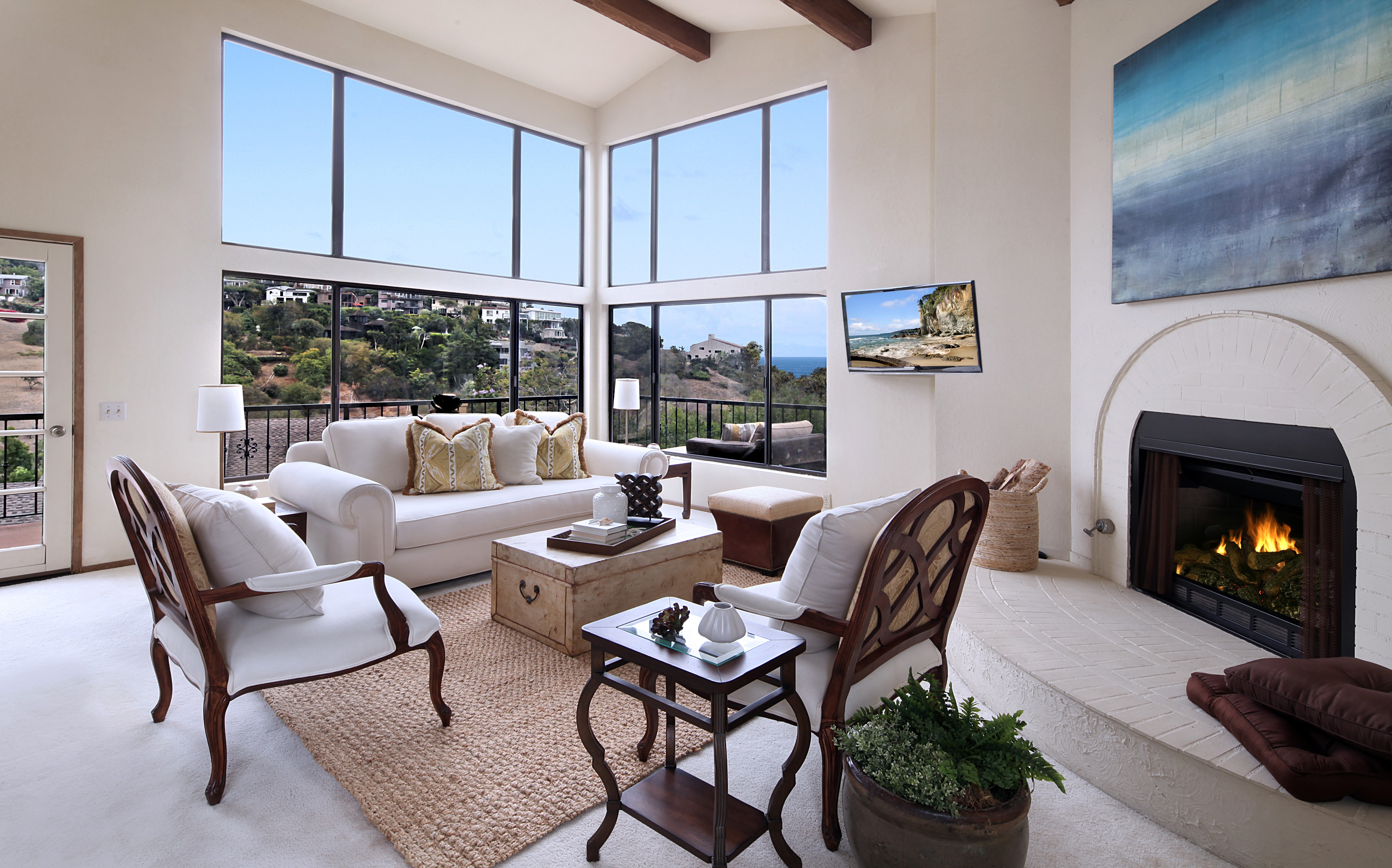 Living room with fireplace, sofa, and chairs HD Wallpaper