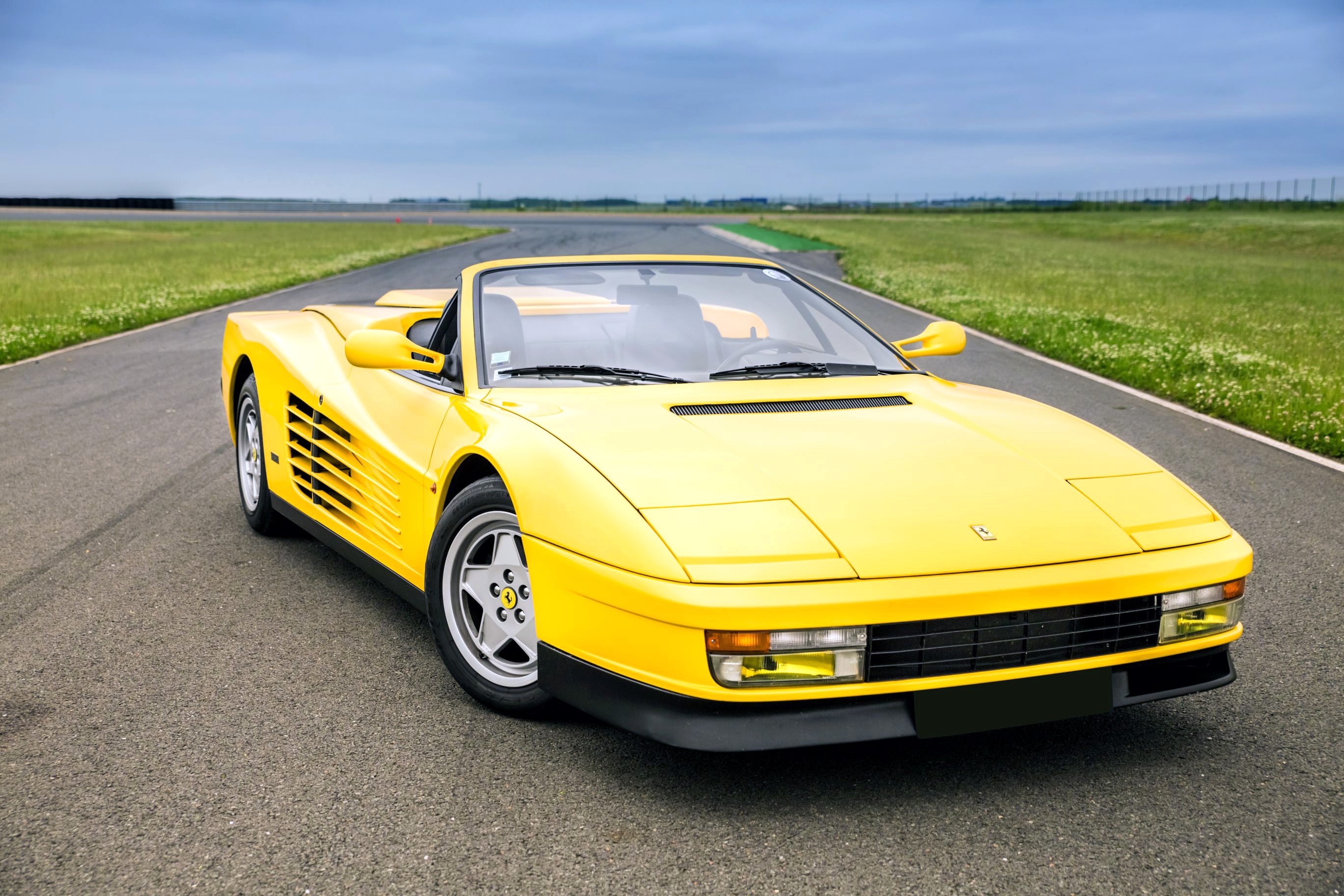 Yellow Ferrari Testarossa Cabriolet on a Racetrack HD Wallpaper