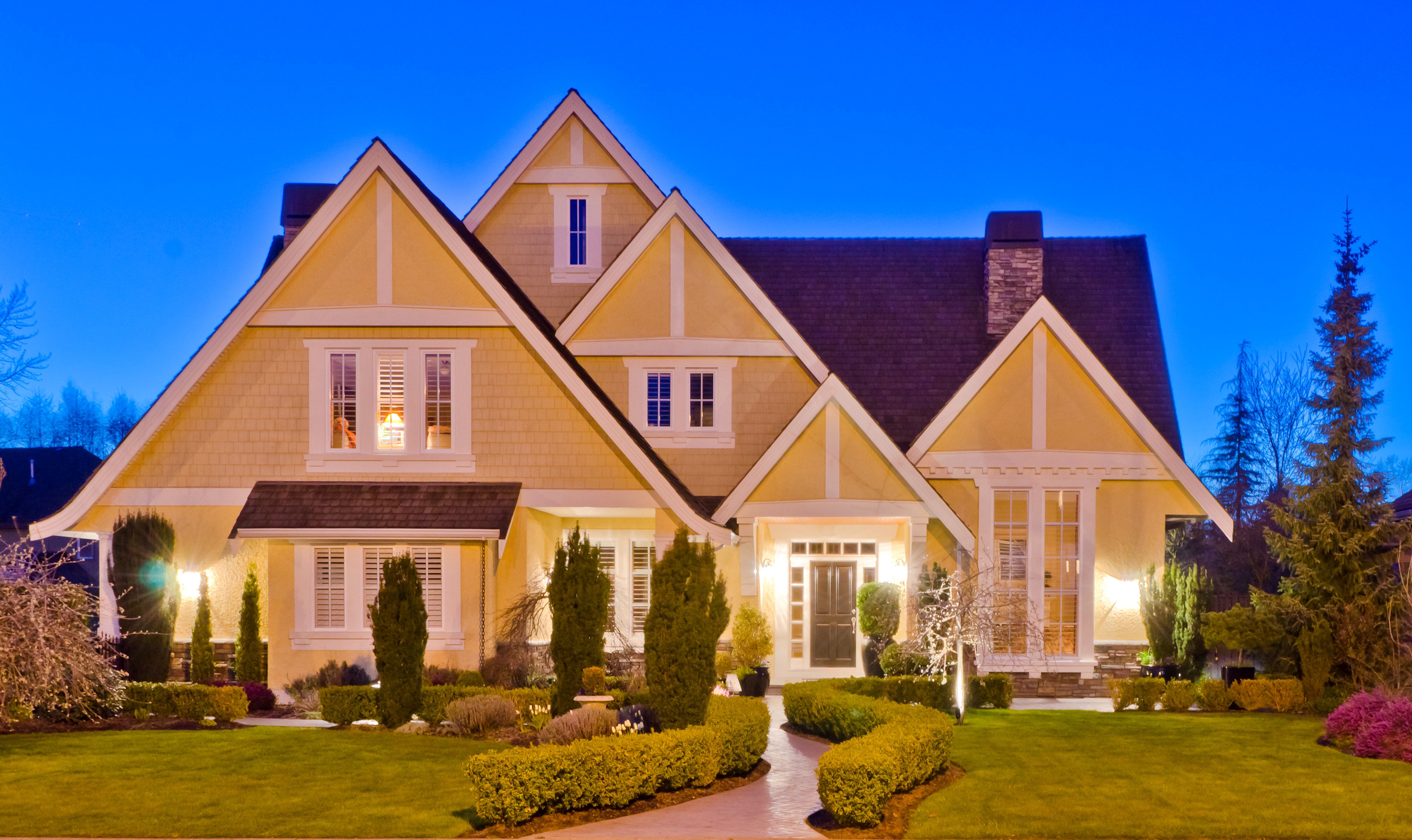 Yellow House with Landscaping at Night HD Wallpaper