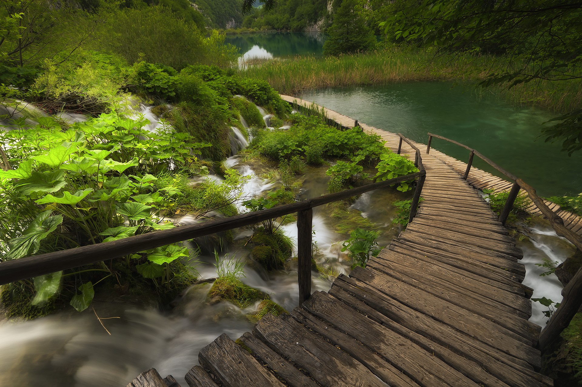 Wooden boardwalk over waterfalls at Plitvice Lakes National Park, Croatia HD Wallpaper