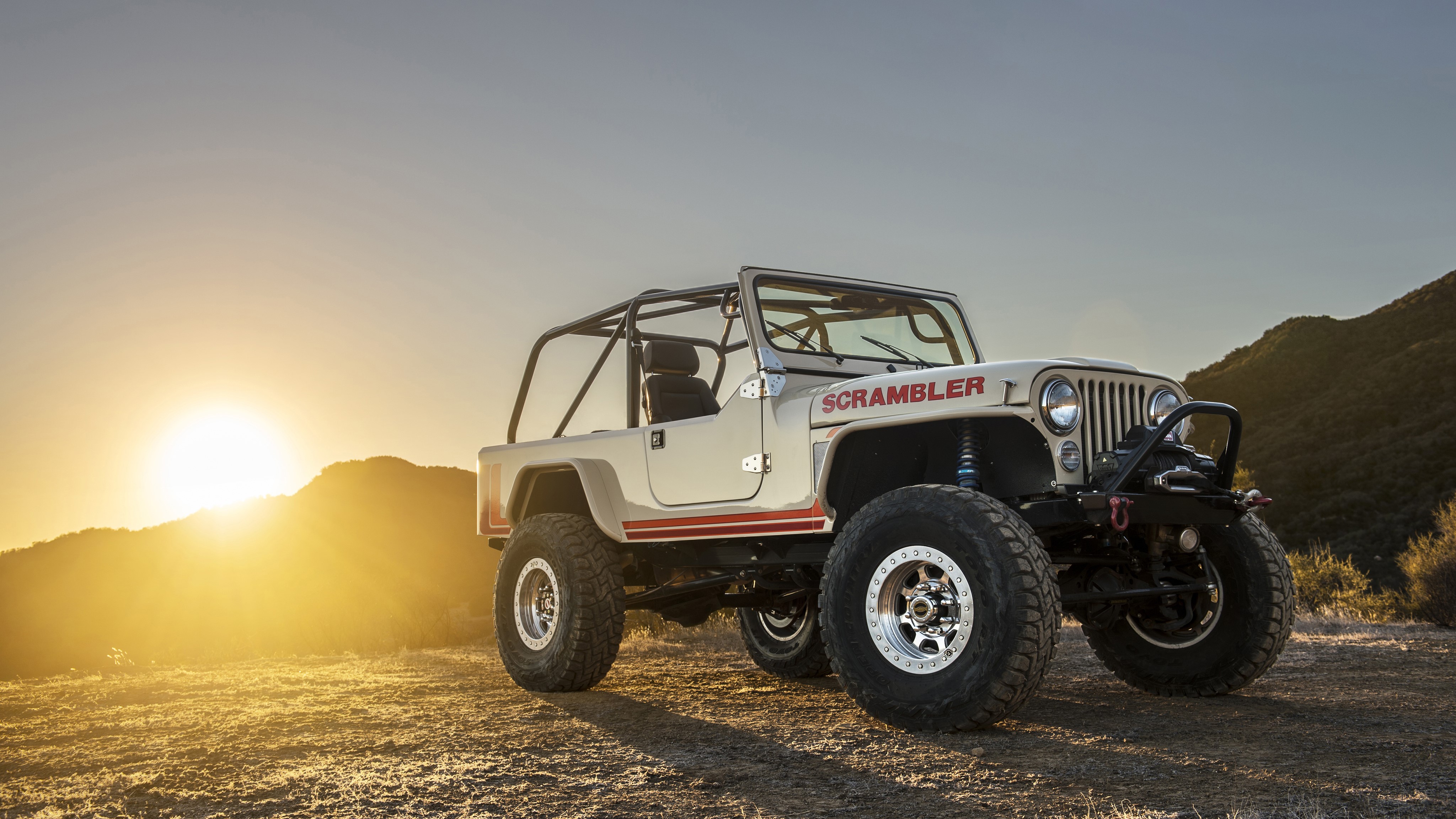Jeep CJ-8 Scrambler off-road vehicle at sunset HD Wallpaper