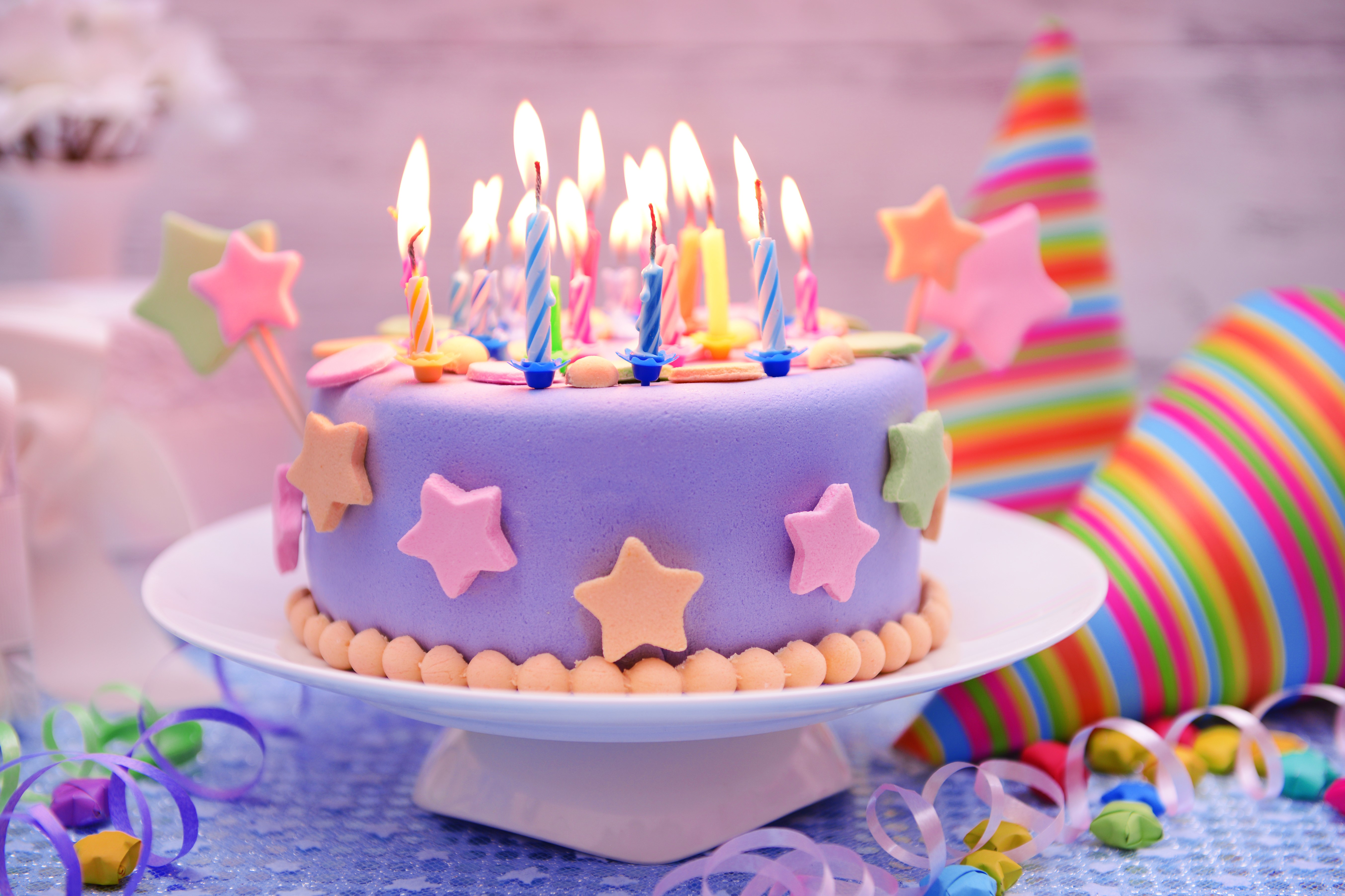 Birthday cake with lit candles and party hats HD Wallpaper