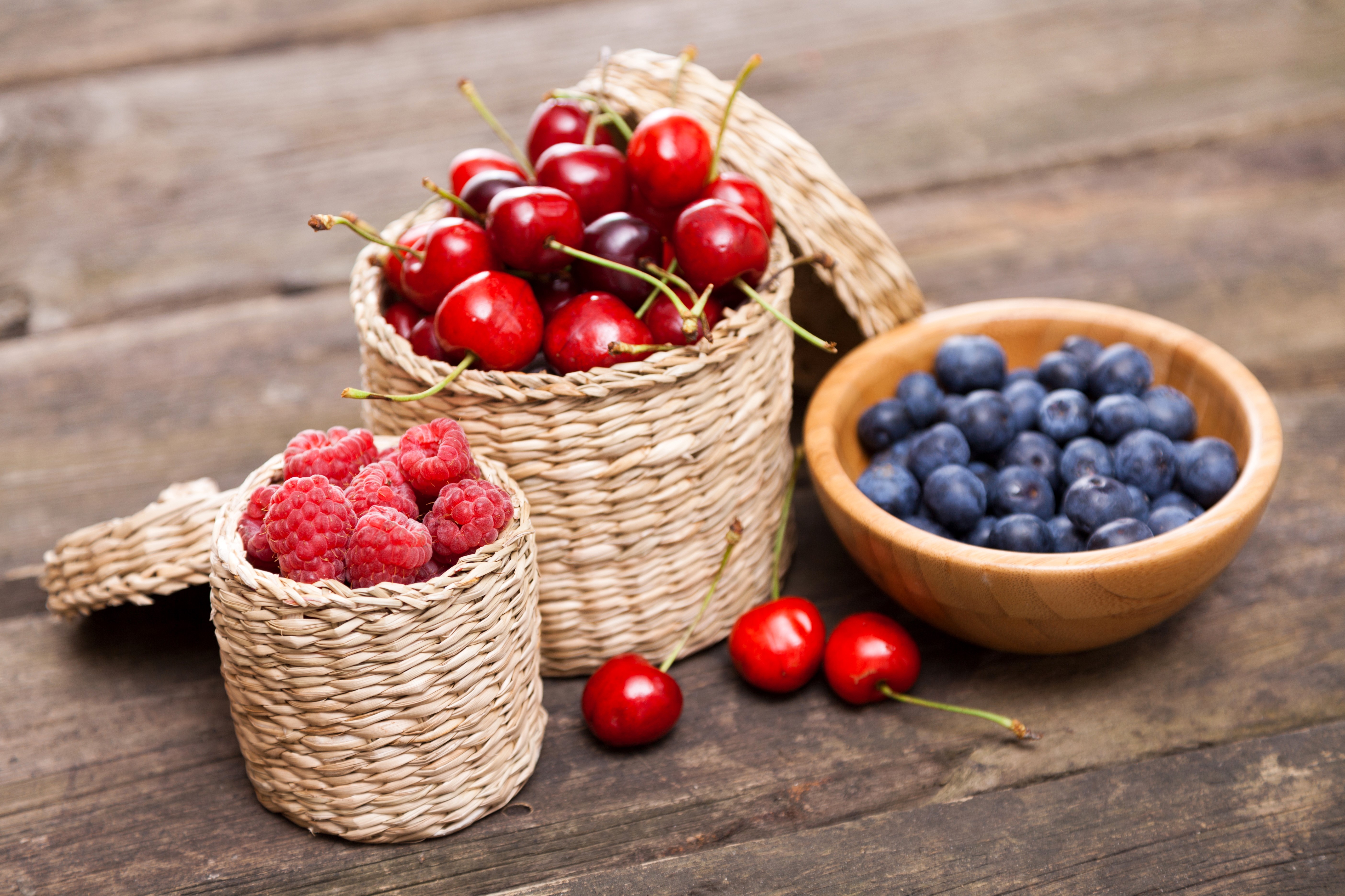 Cherries, Blueberries, and Raspberries in Wicker Baskets HD Wallpaper