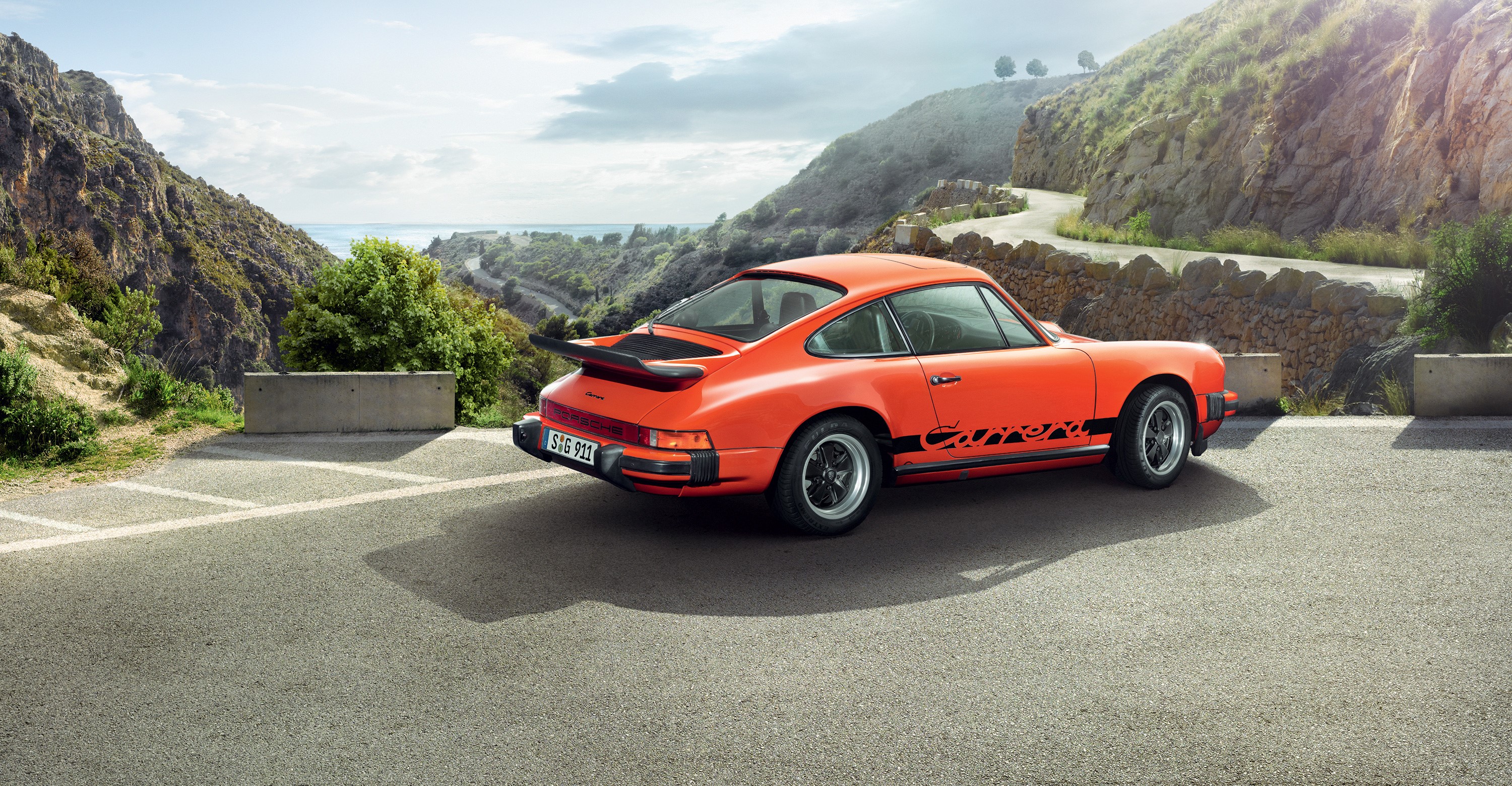 Orange Porsche 911 Carrera Coupe on Mountain Road HD Wallpaper