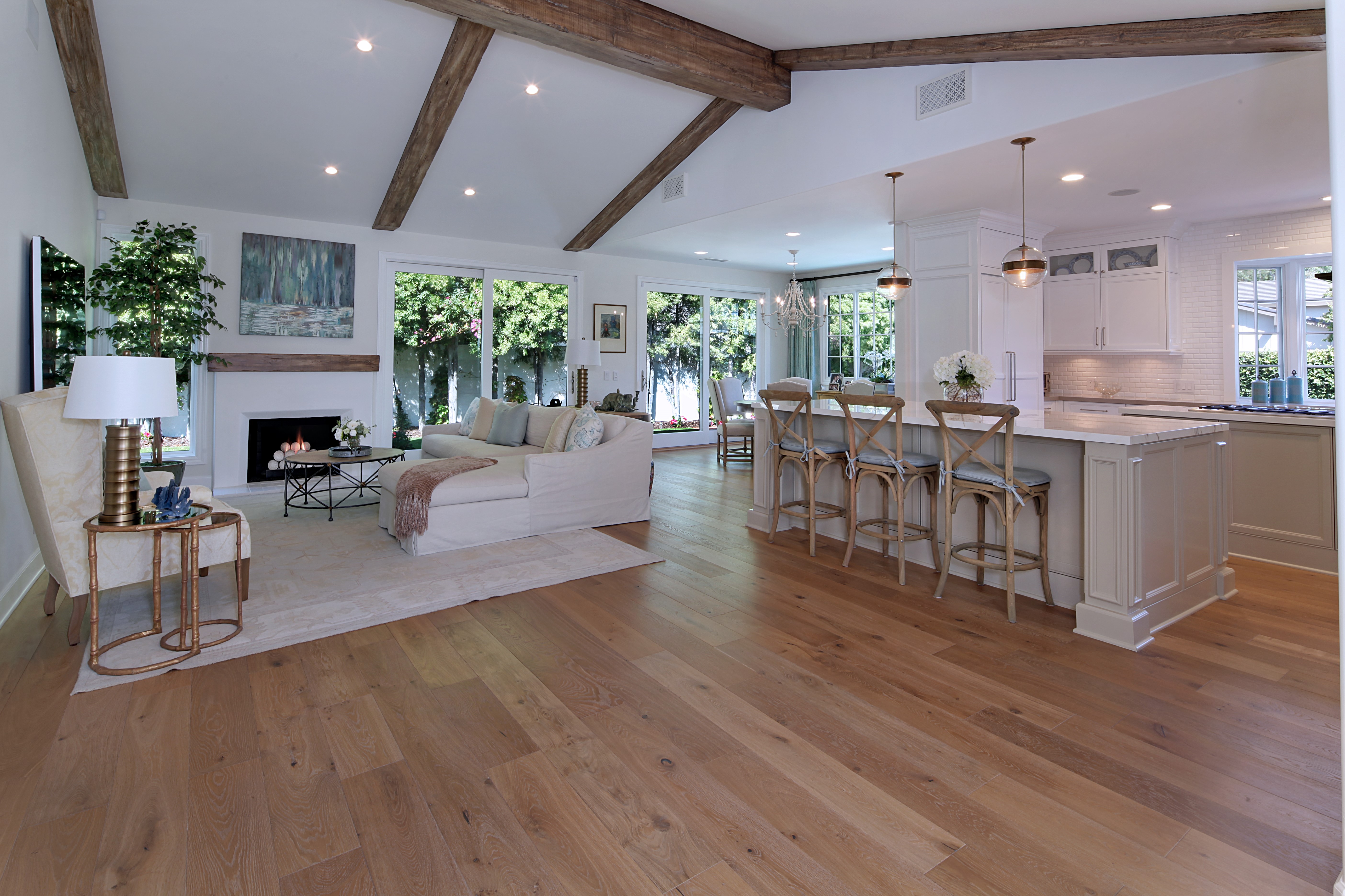 Interior Design of a Living Room and Kitchen with Sofa and Island HD Wallpaper