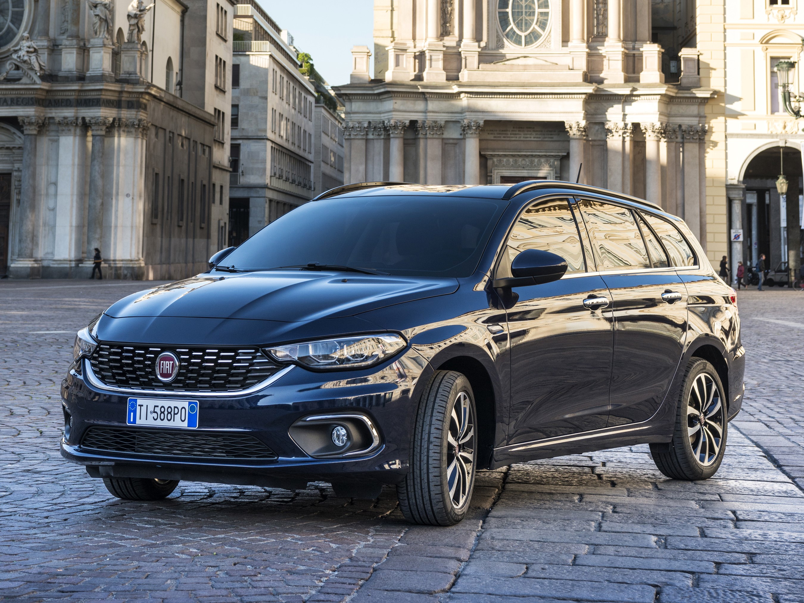 Fiat Tipo Station Wagon parked on cobblestone street HD Wallpaper