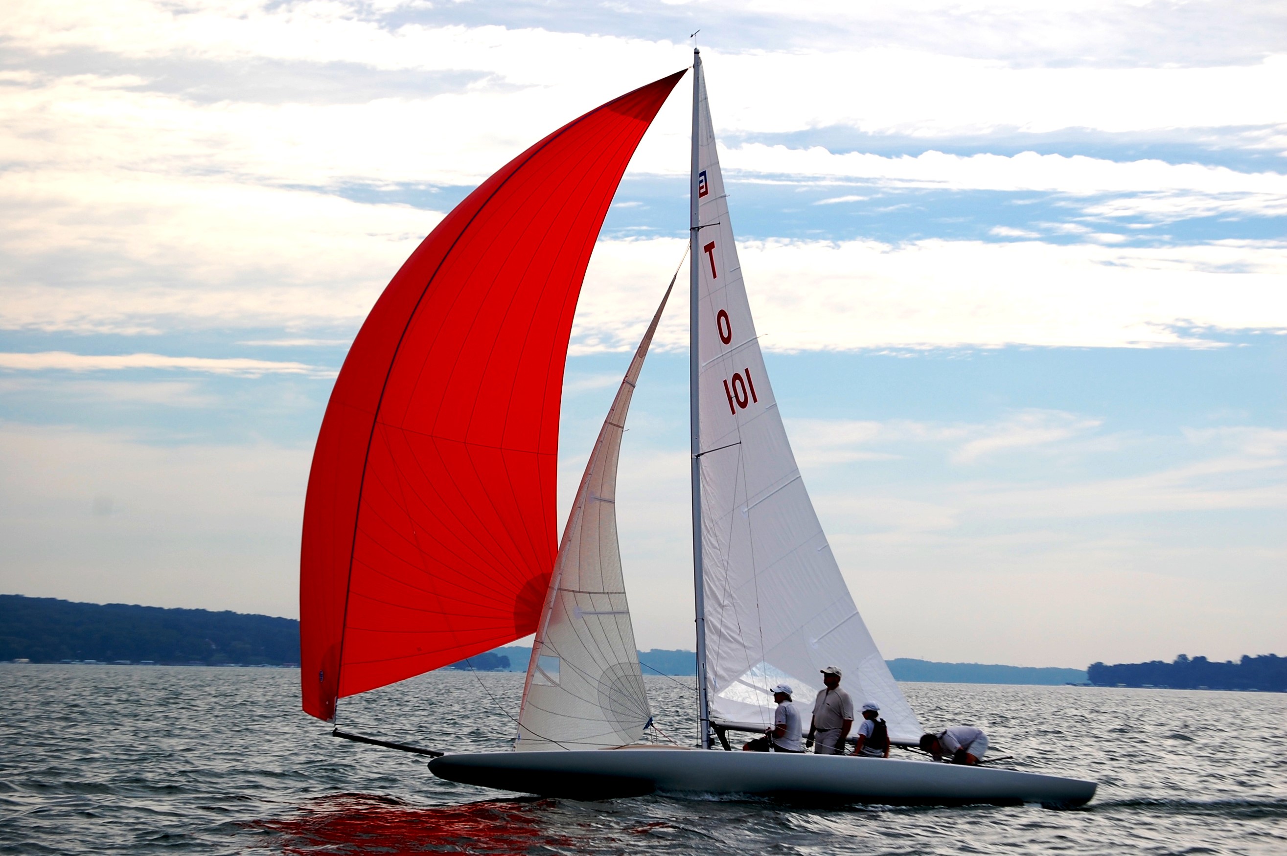 Sailboat with red and white sails on the water HD Wallpaper