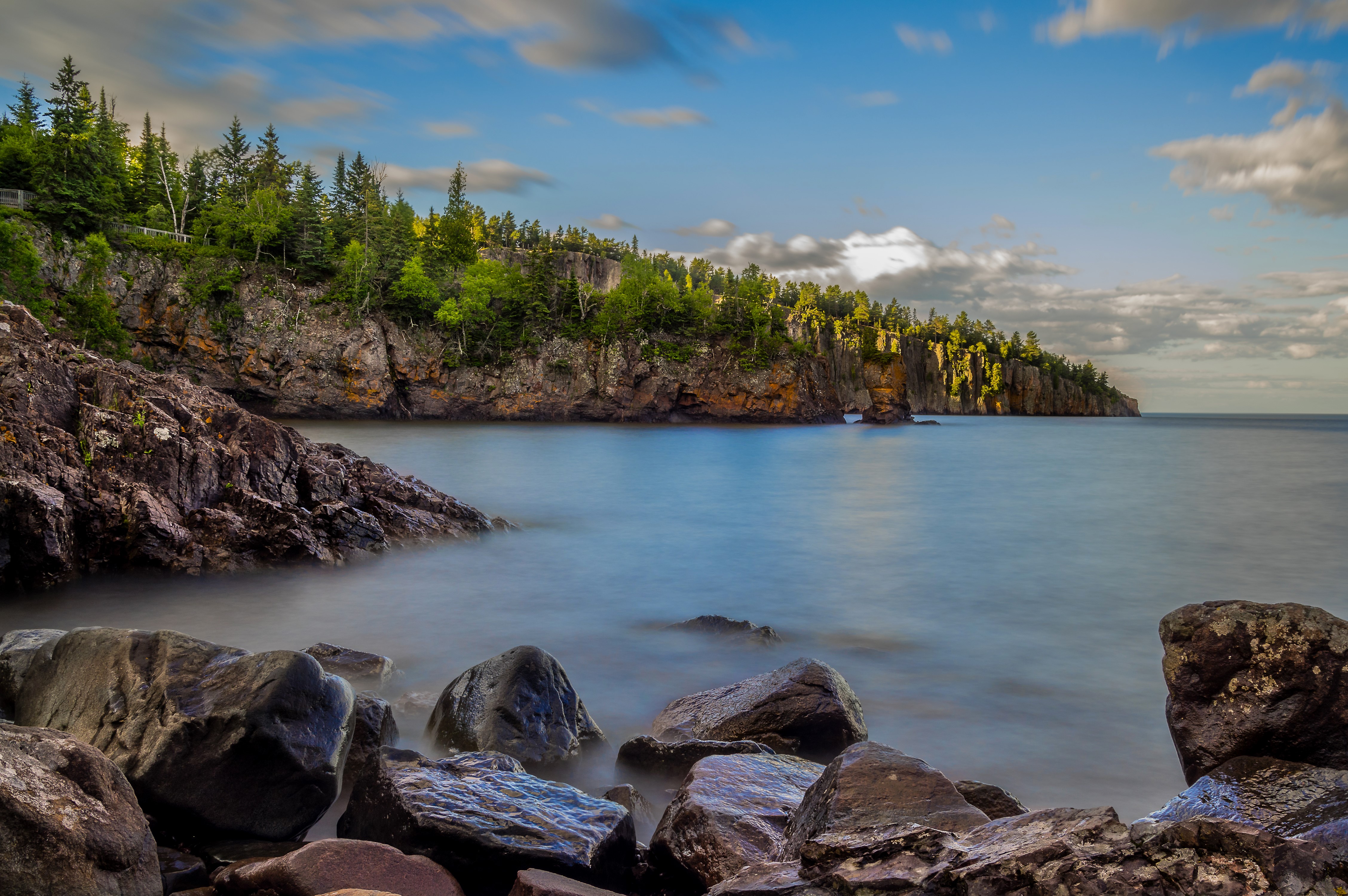 Lake Superior Shoreline with Rocky Outcrops and Forest HD Wallpaper