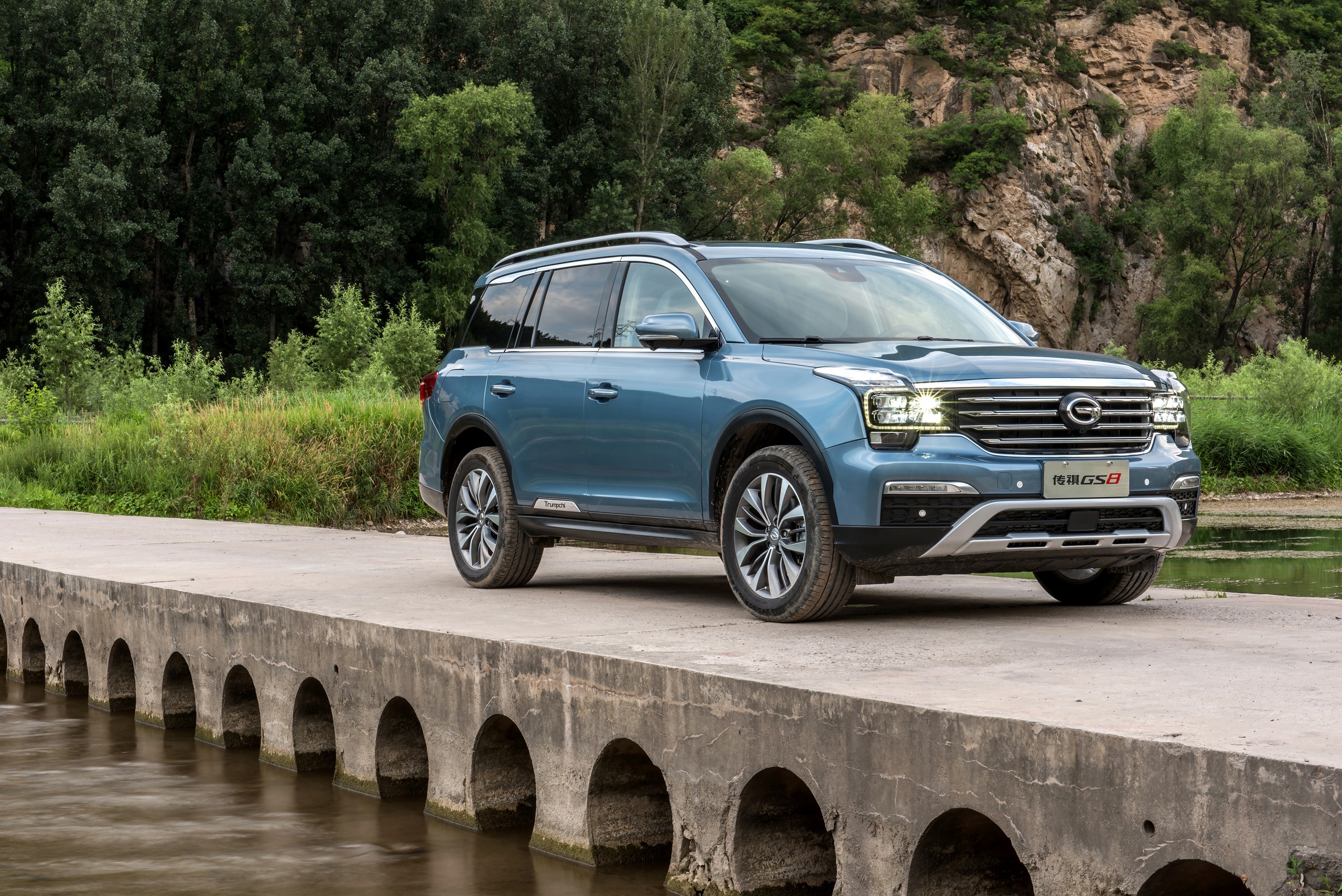 Light Blue 2016 Trumpchi GS8 SUV on a Bridge HD Wallpaper