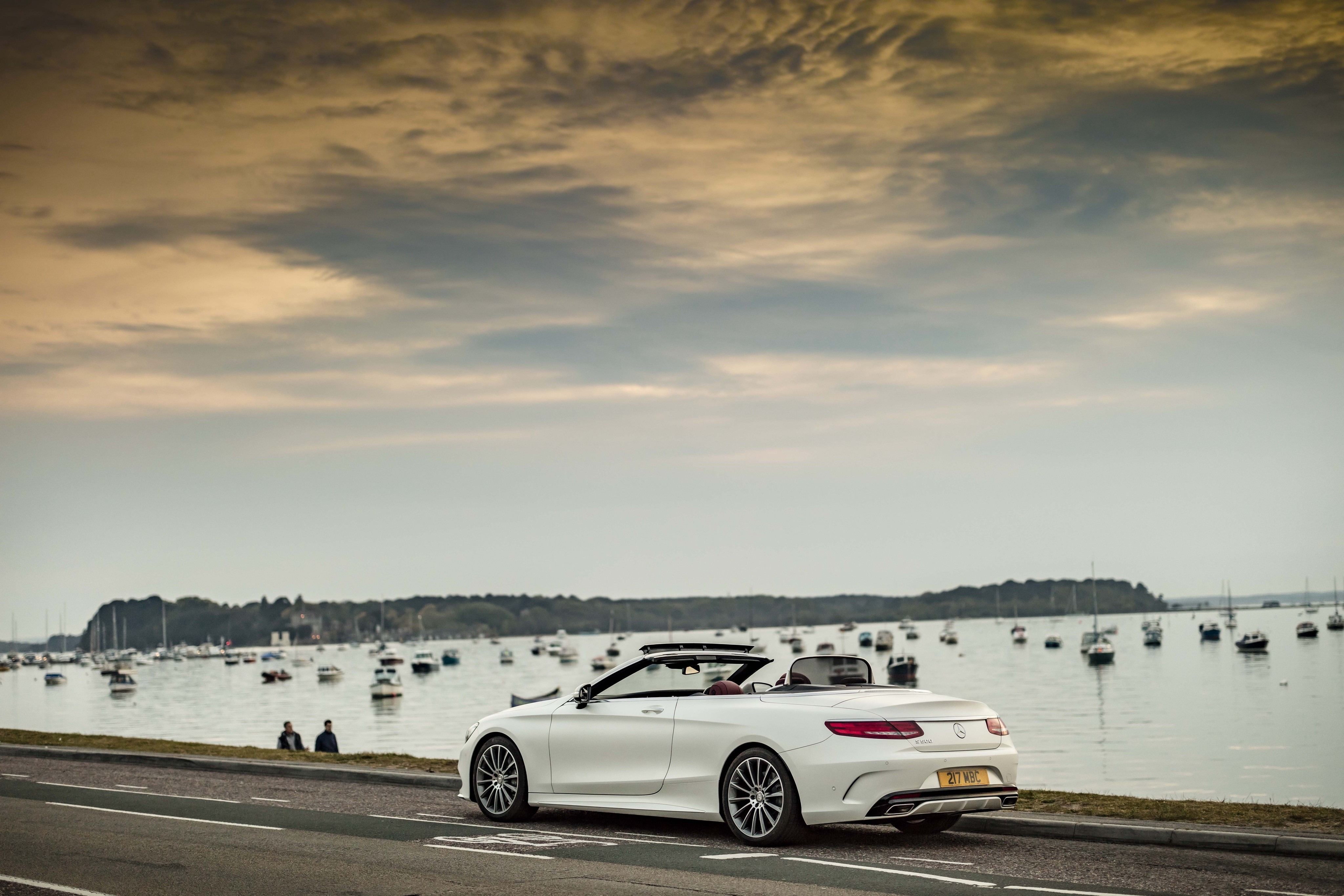 White Mercedes-Benz S 500 Cabriolet AMG line by the water HD Wallpaper
