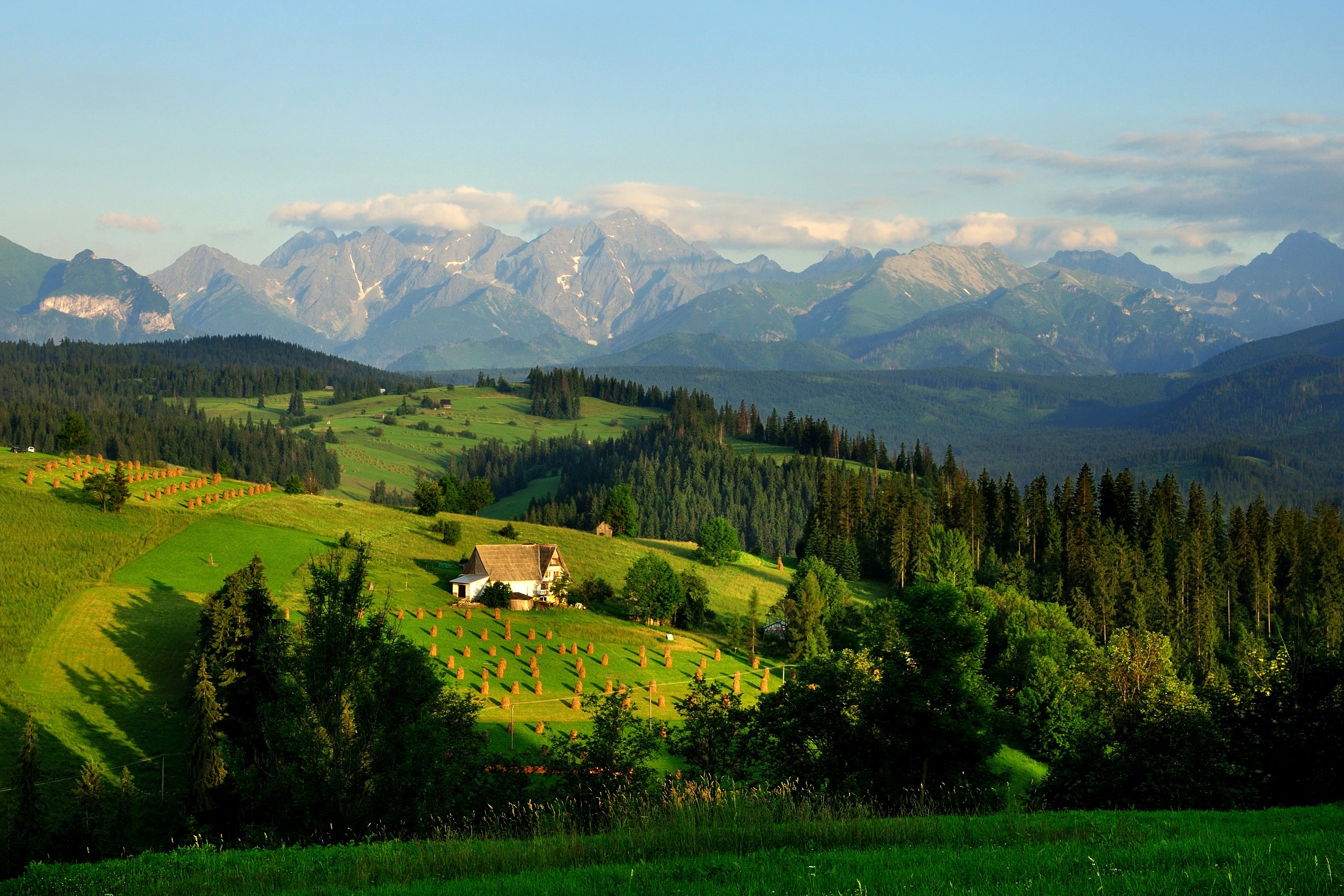 Tatra Mountains landscape with a house and hay bales HD Wallpaper