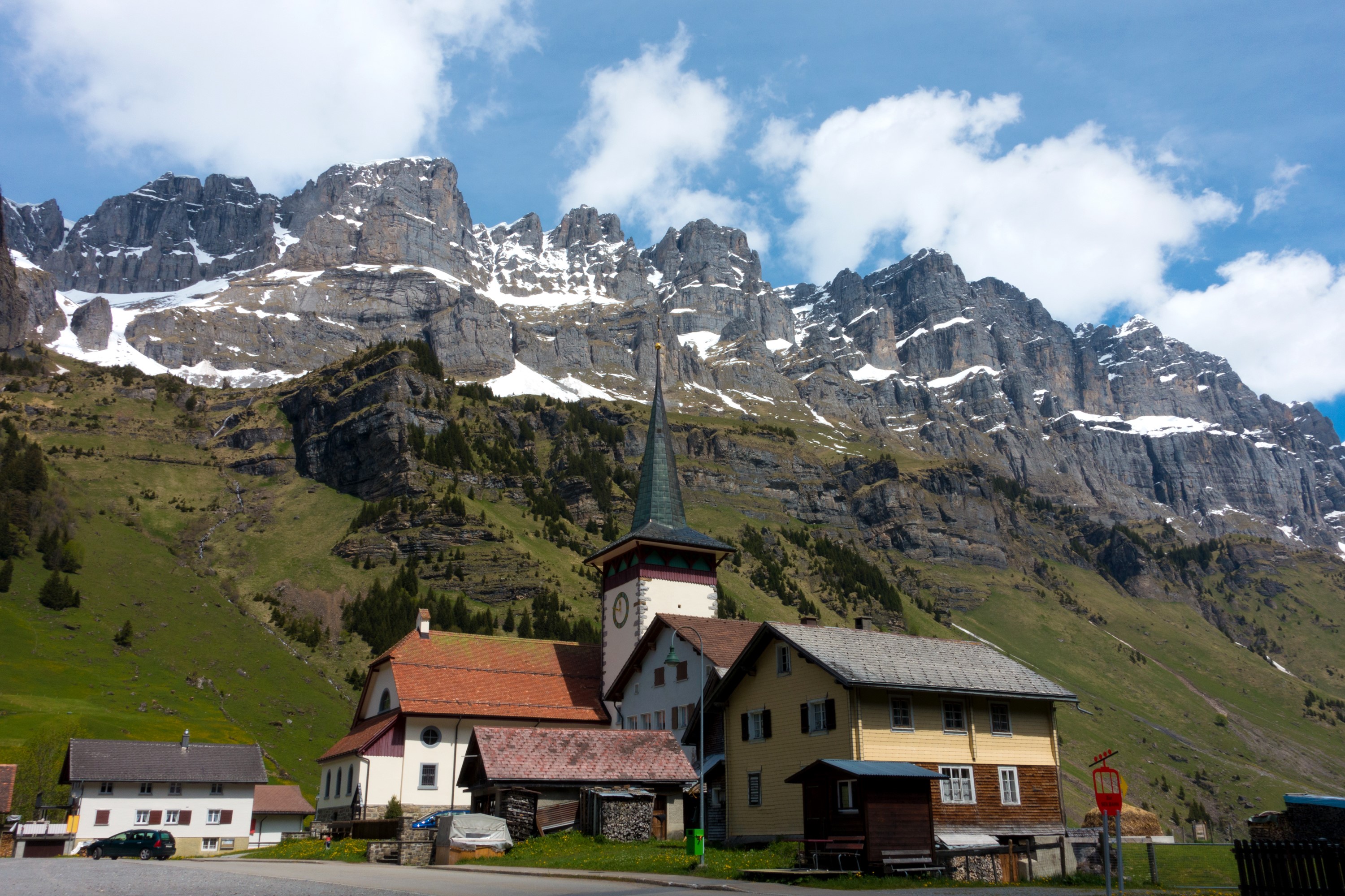 Urnerboden village with mountains in Switzerland HD Wallpaper