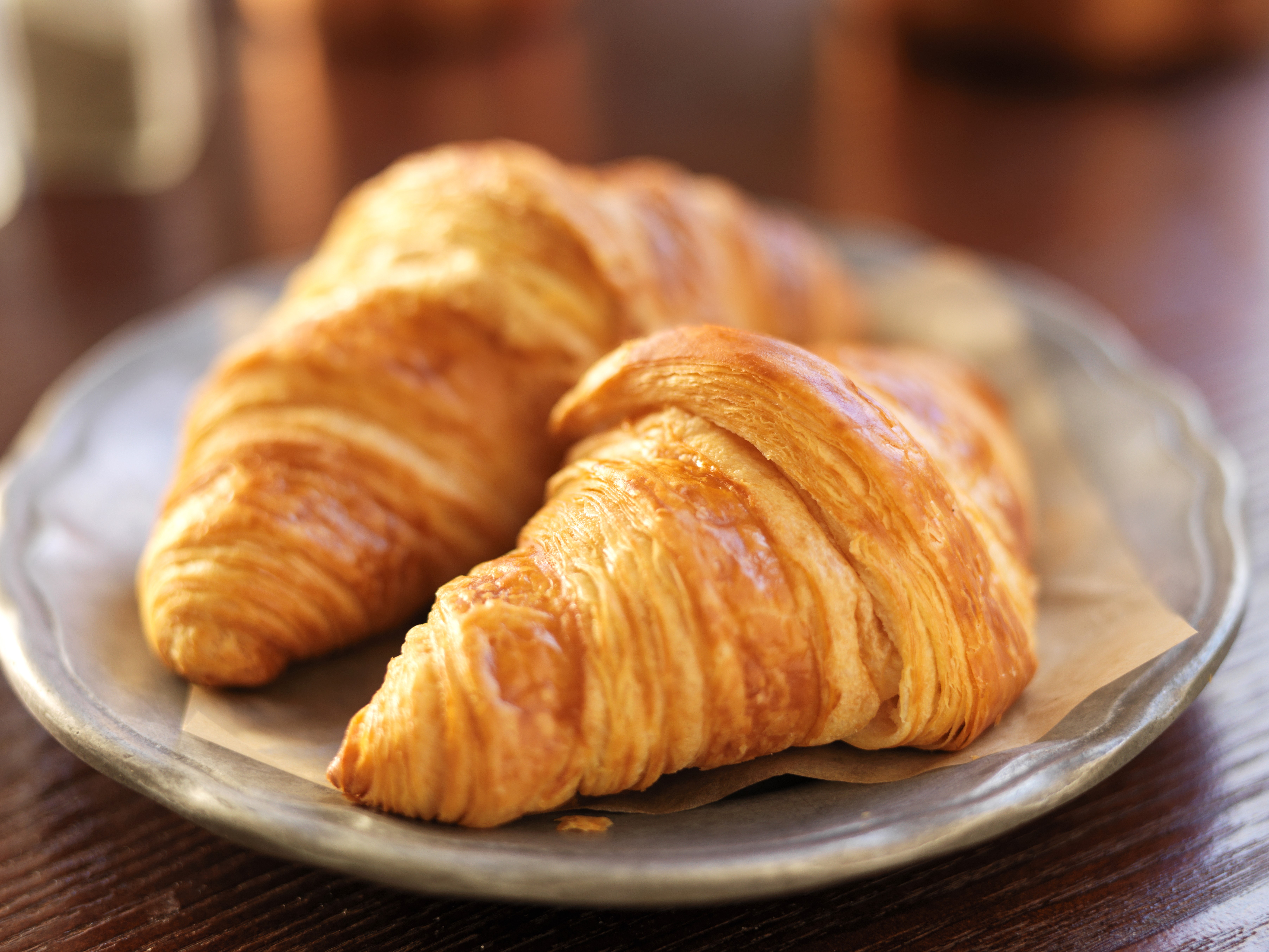 Two croissants on a plate HD Wallpaper