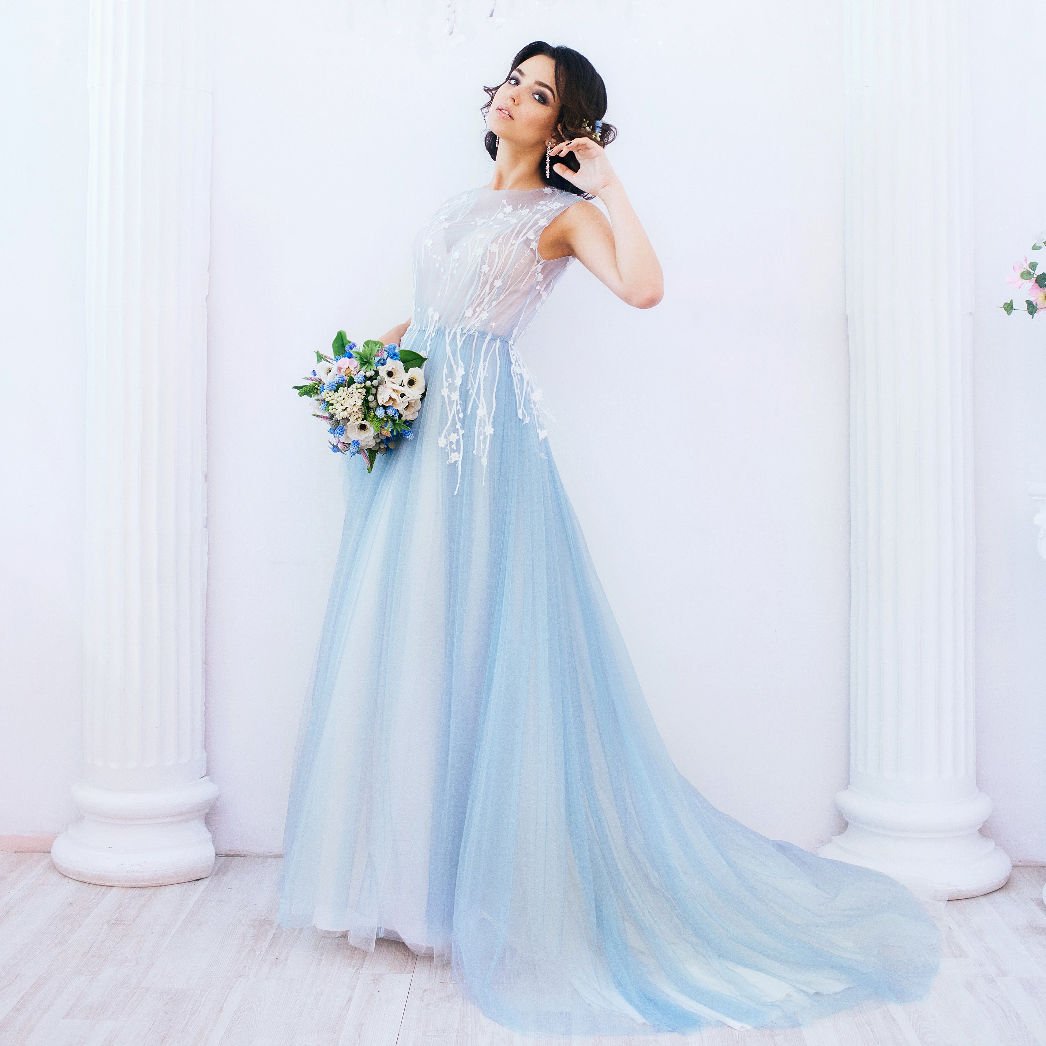 Woman in a light blue dress holding a bouquet HD Wallpaper