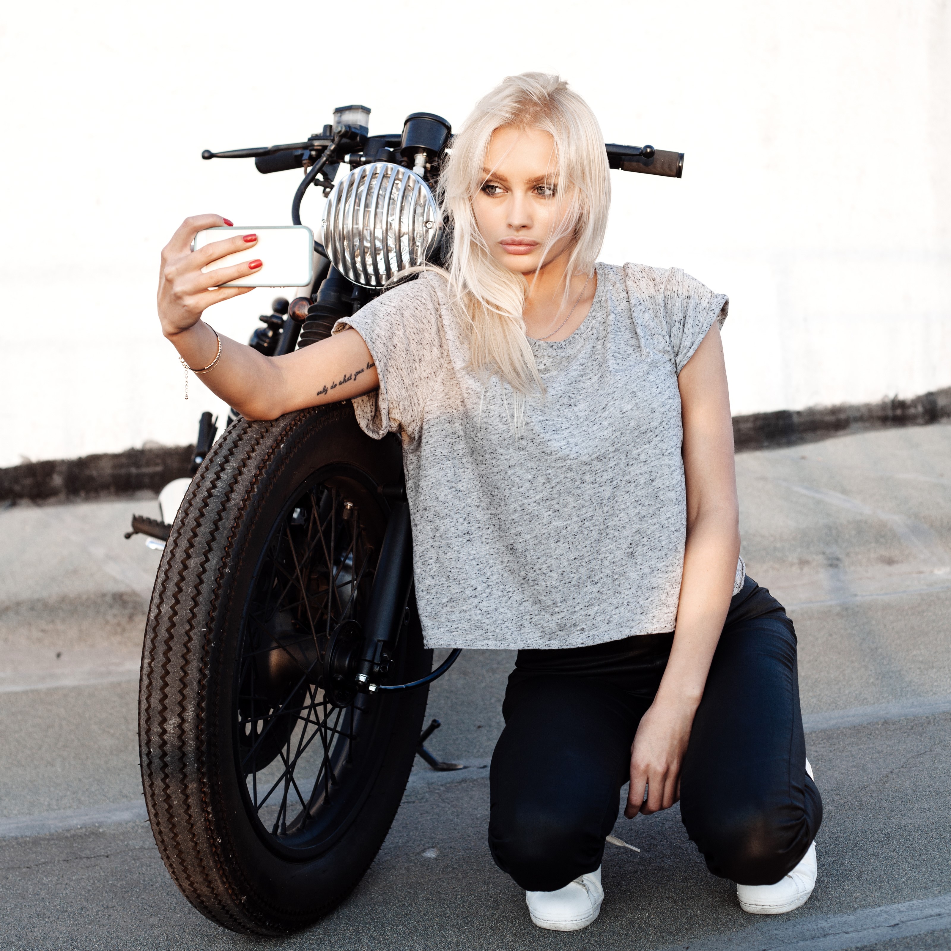 Blonde woman taking a selfie with a motorcycle HD Wallpaper